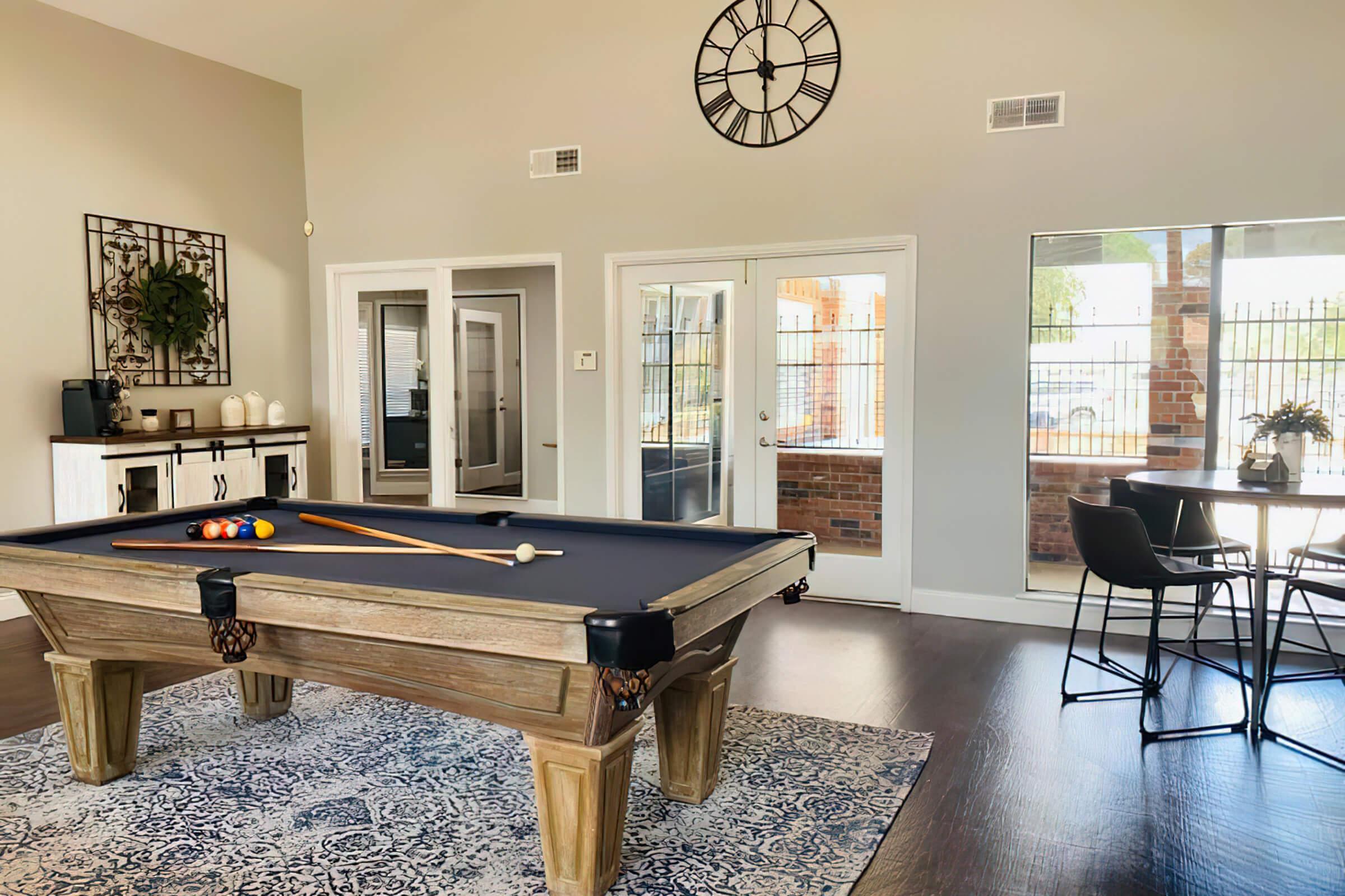 a living room filled with furniture and a large window