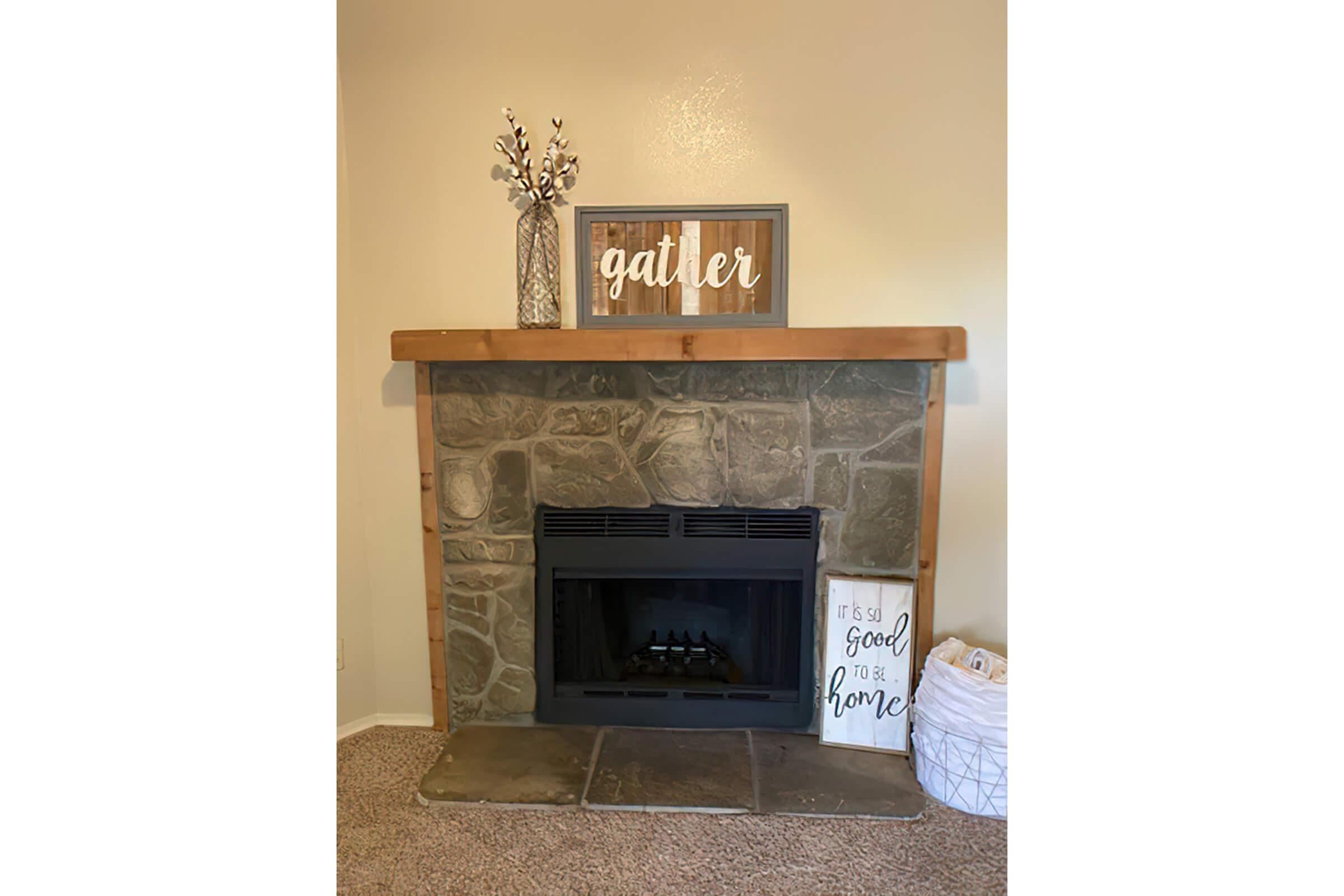 a fire place sitting in a living room with a fireplace