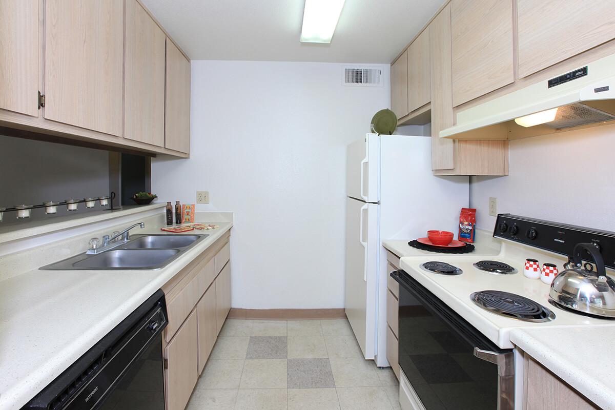 a kitchen with a white stove top oven