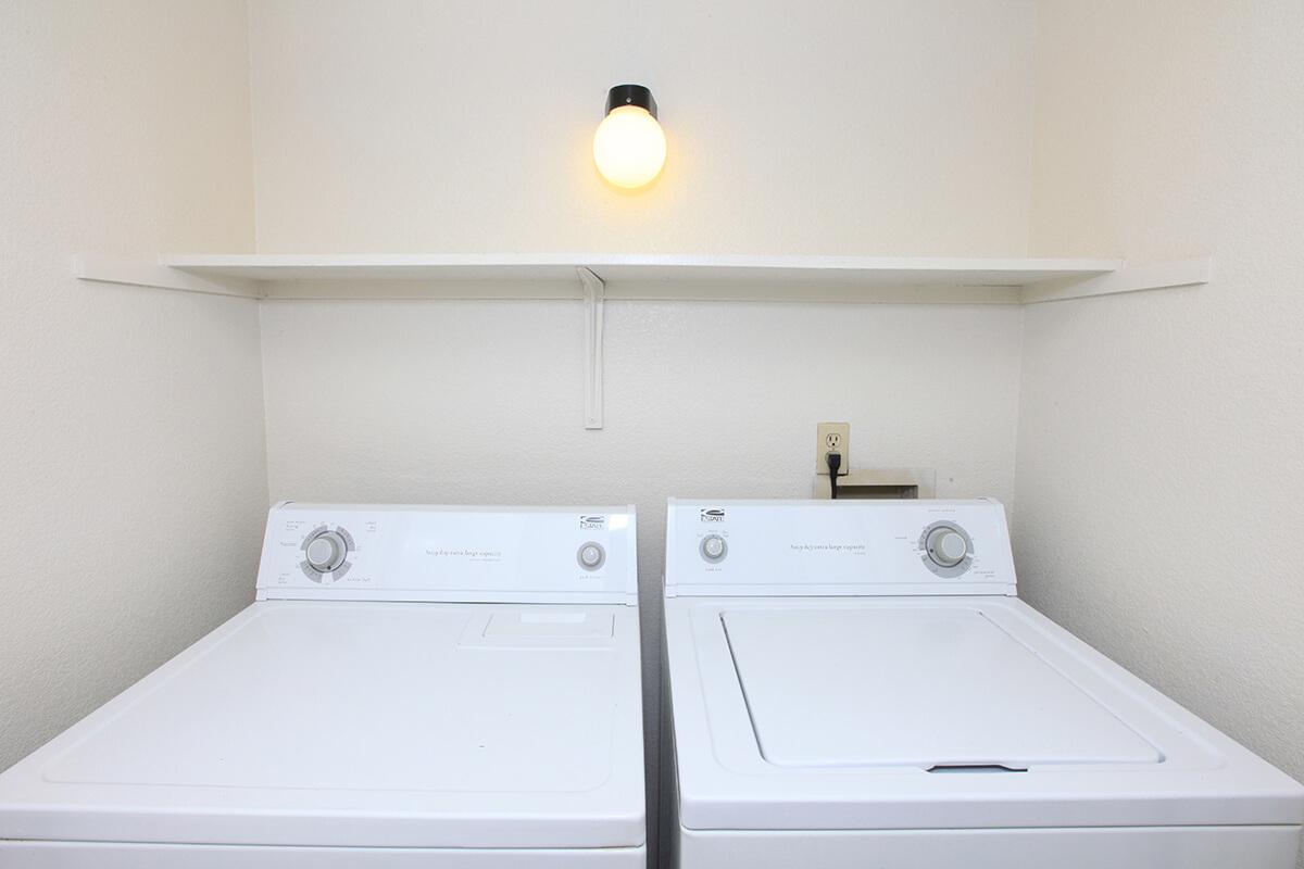 a white sink sitting next to a counter