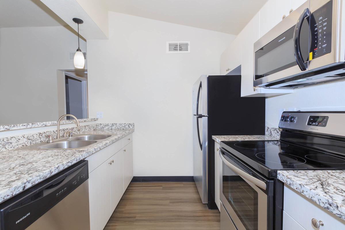 a kitchen with a stove and a sink