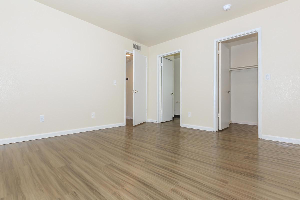 a large empty room with a wooden floor