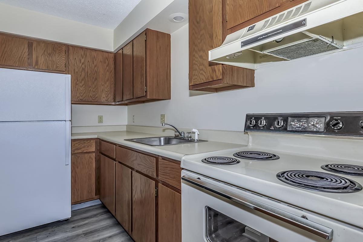 a kitchen with a stove top oven sitting inside of a refrigerator