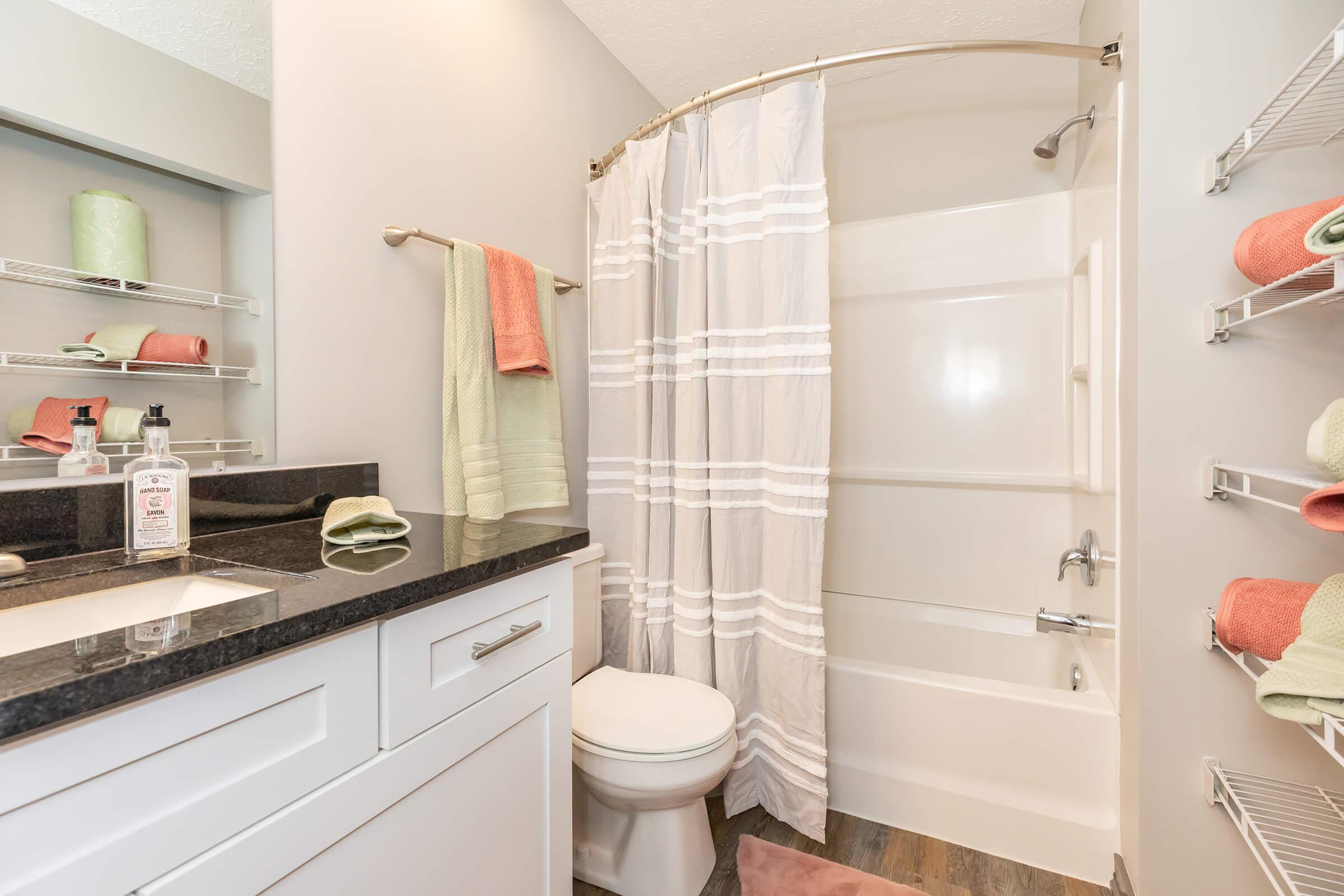 a room with a sink and a mirror