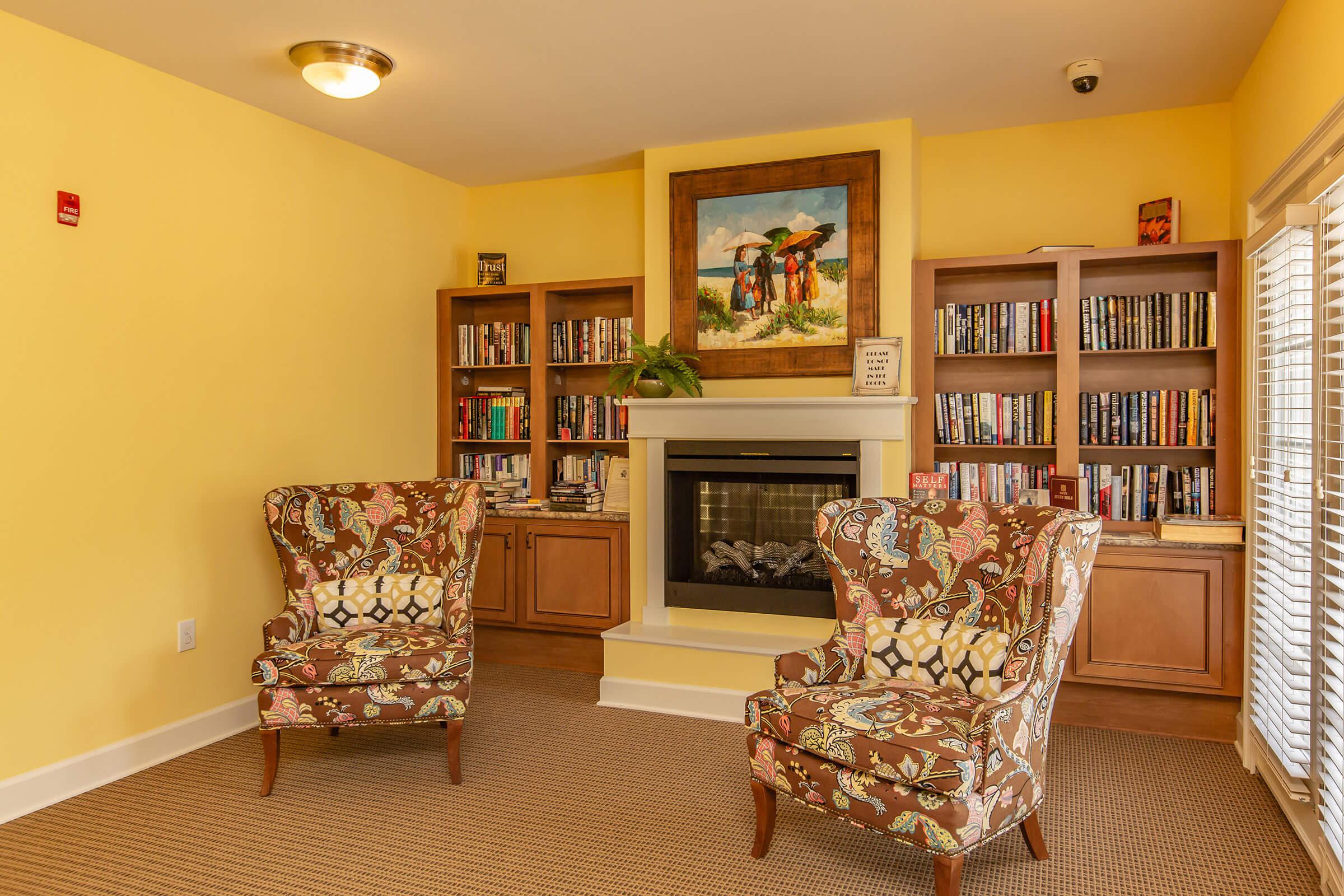 a living room filled with furniture and a fire place