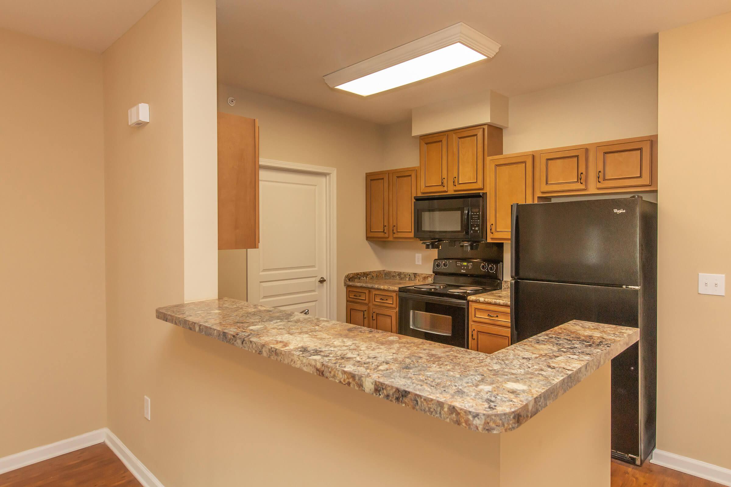 a kitchen with a sink and a refrigerator