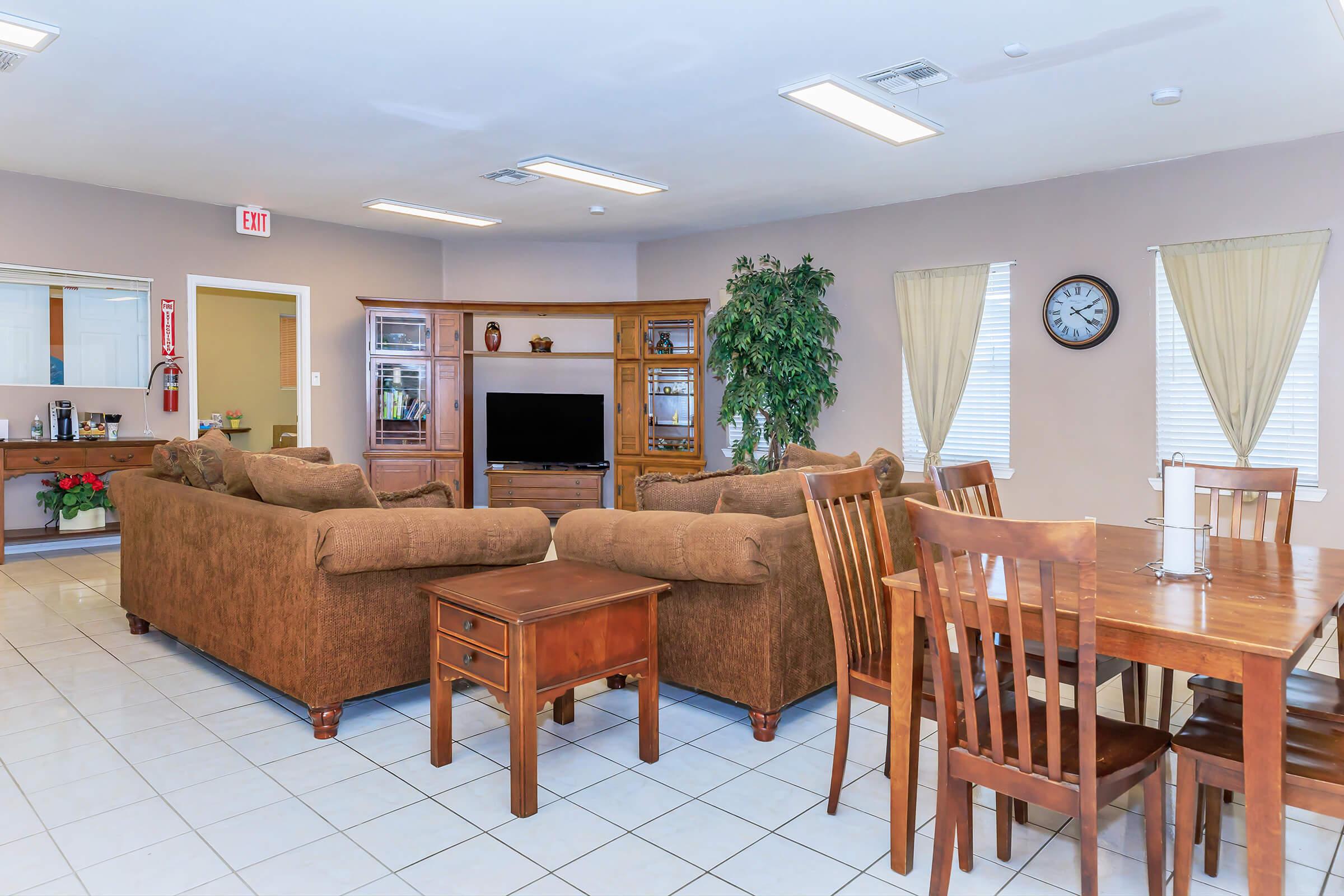 a living room filled with furniture on top of a wooden table