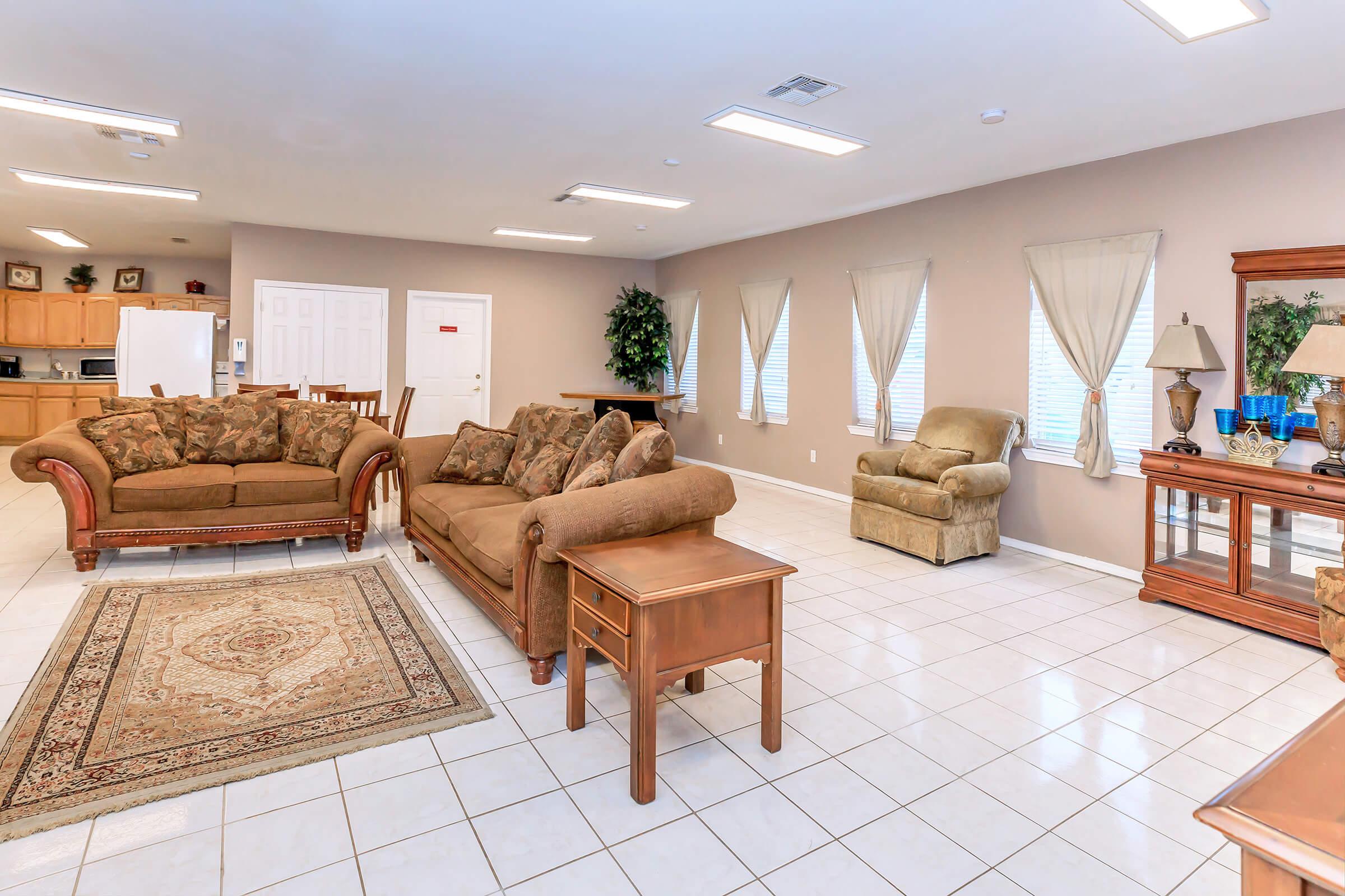 a living room filled with furniture and a fire place