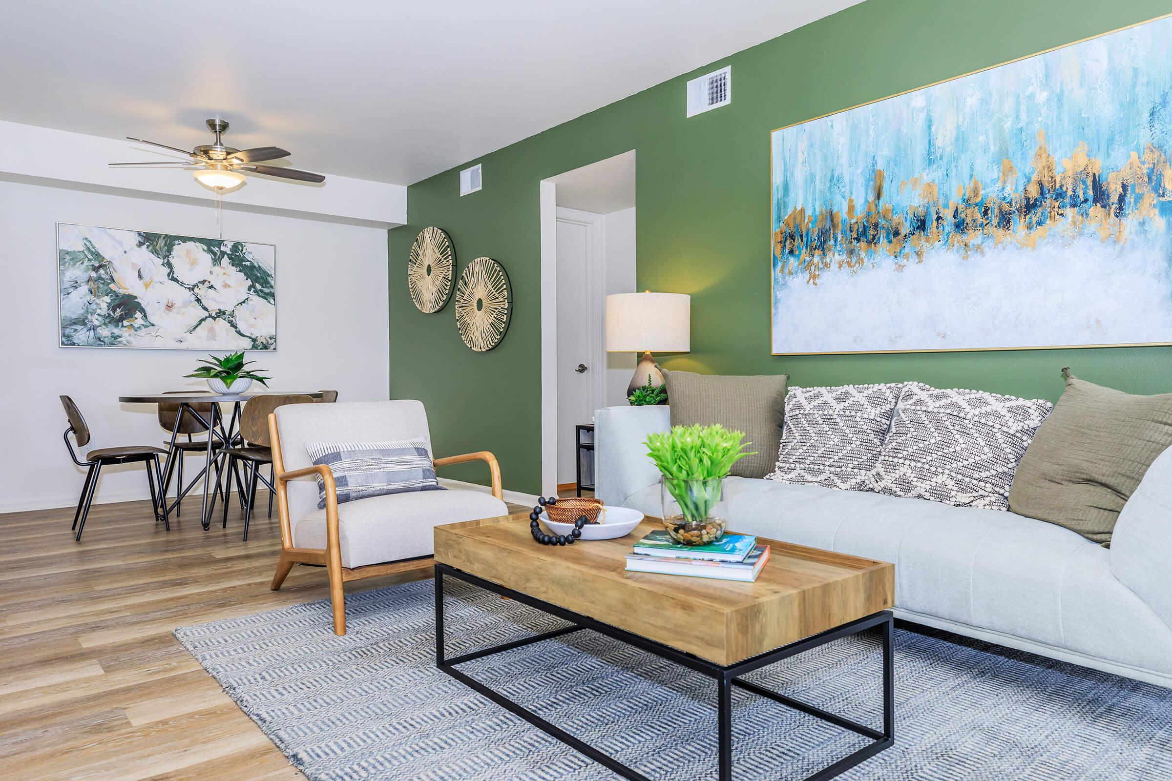 a living room filled with furniture and a table