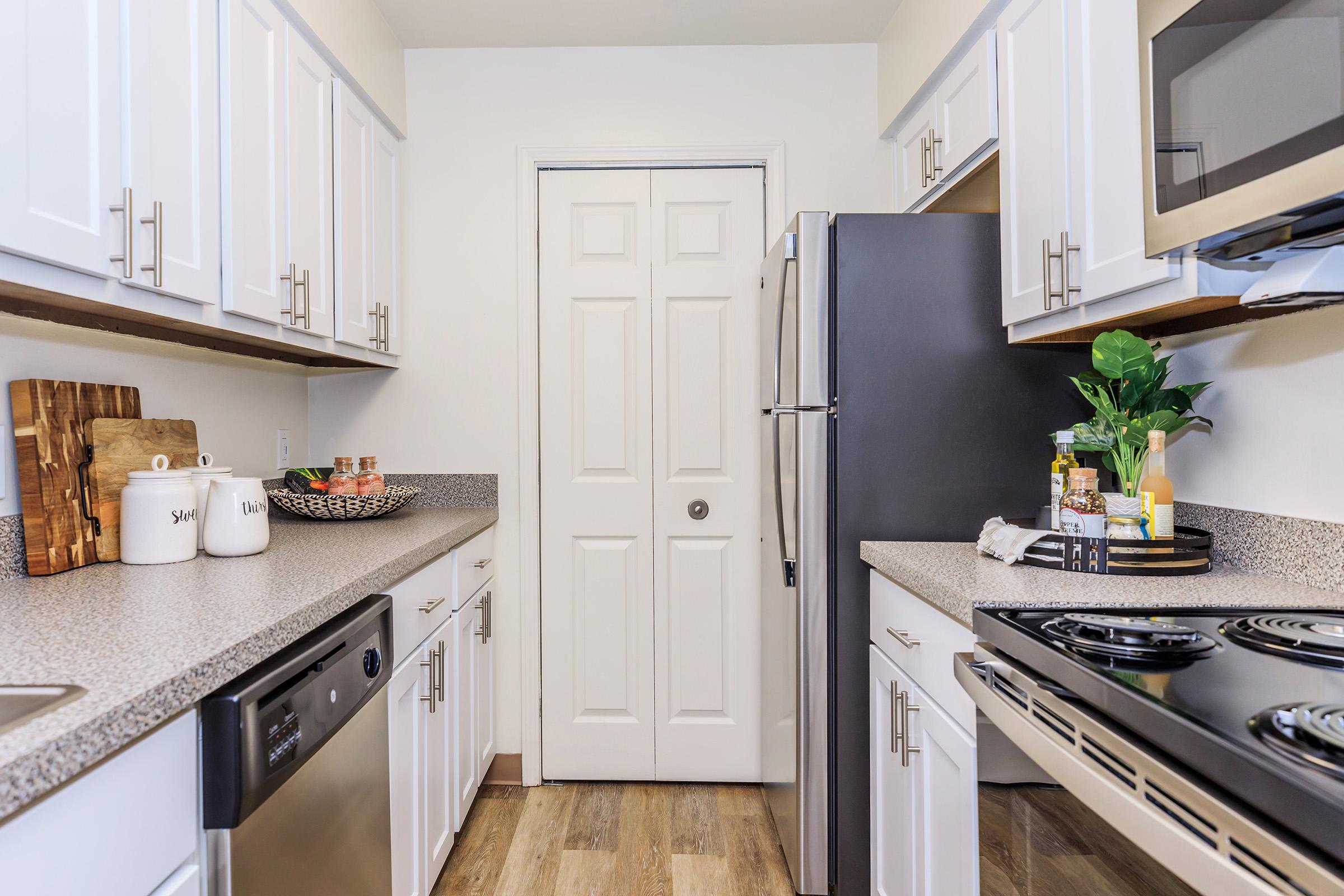 a kitchen with a stove and a sink