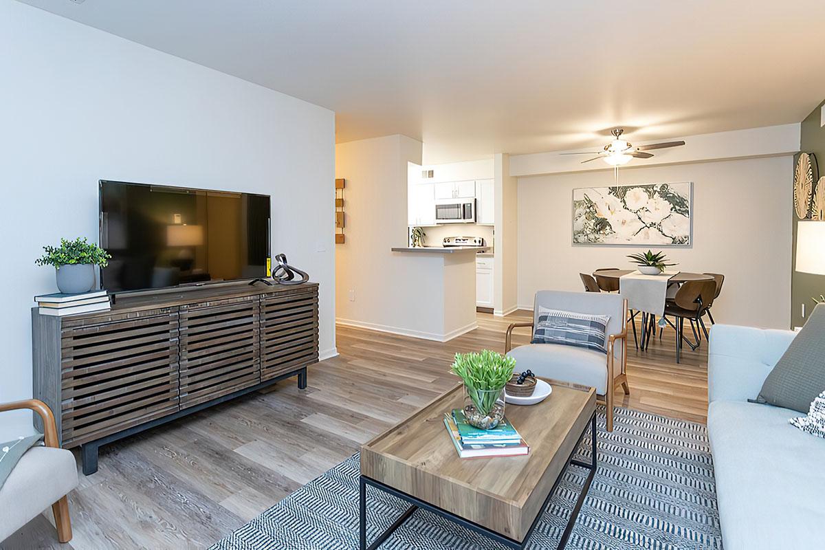 a living room filled with furniture and a table