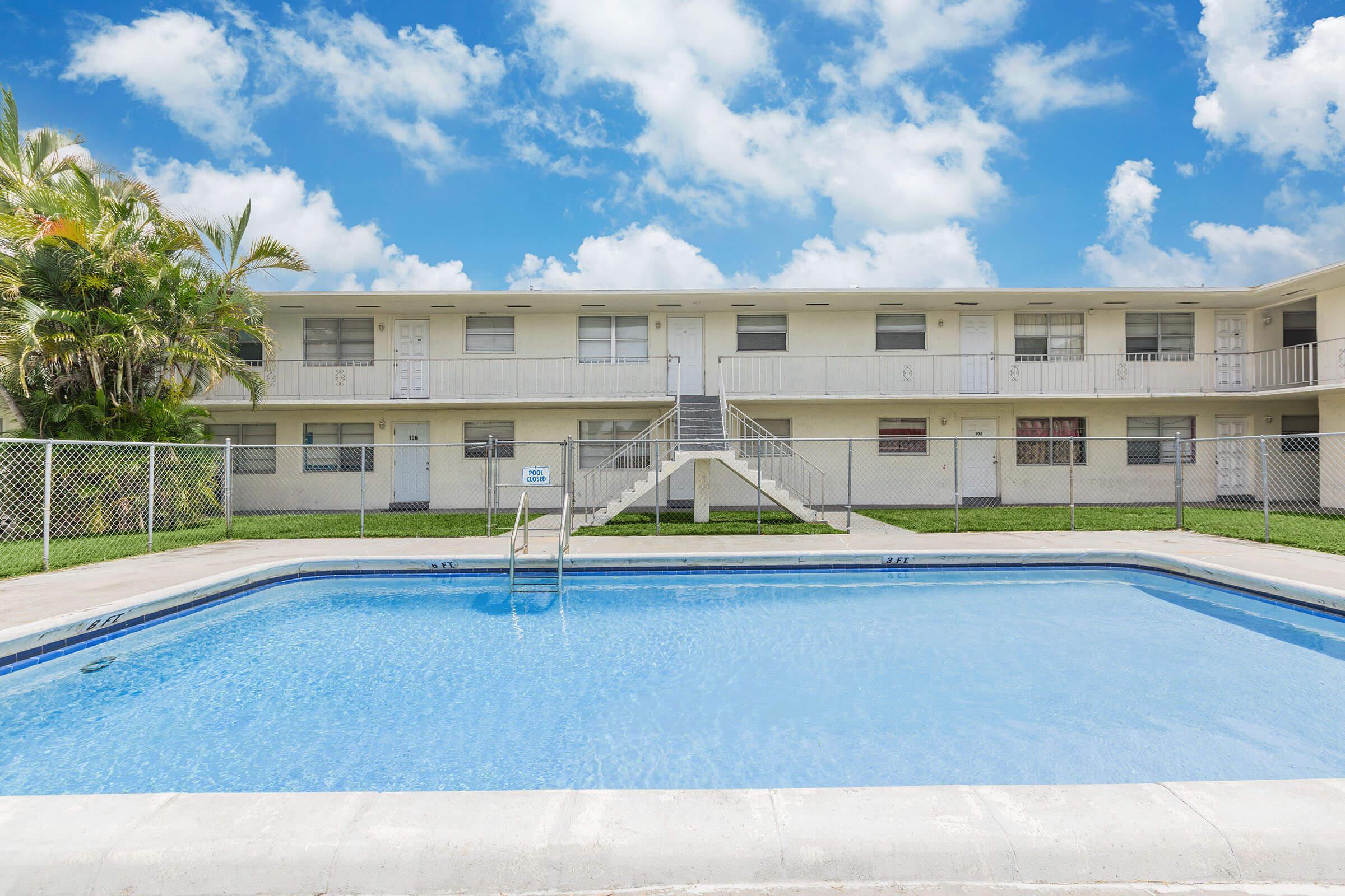 a large pool of water in front of a building