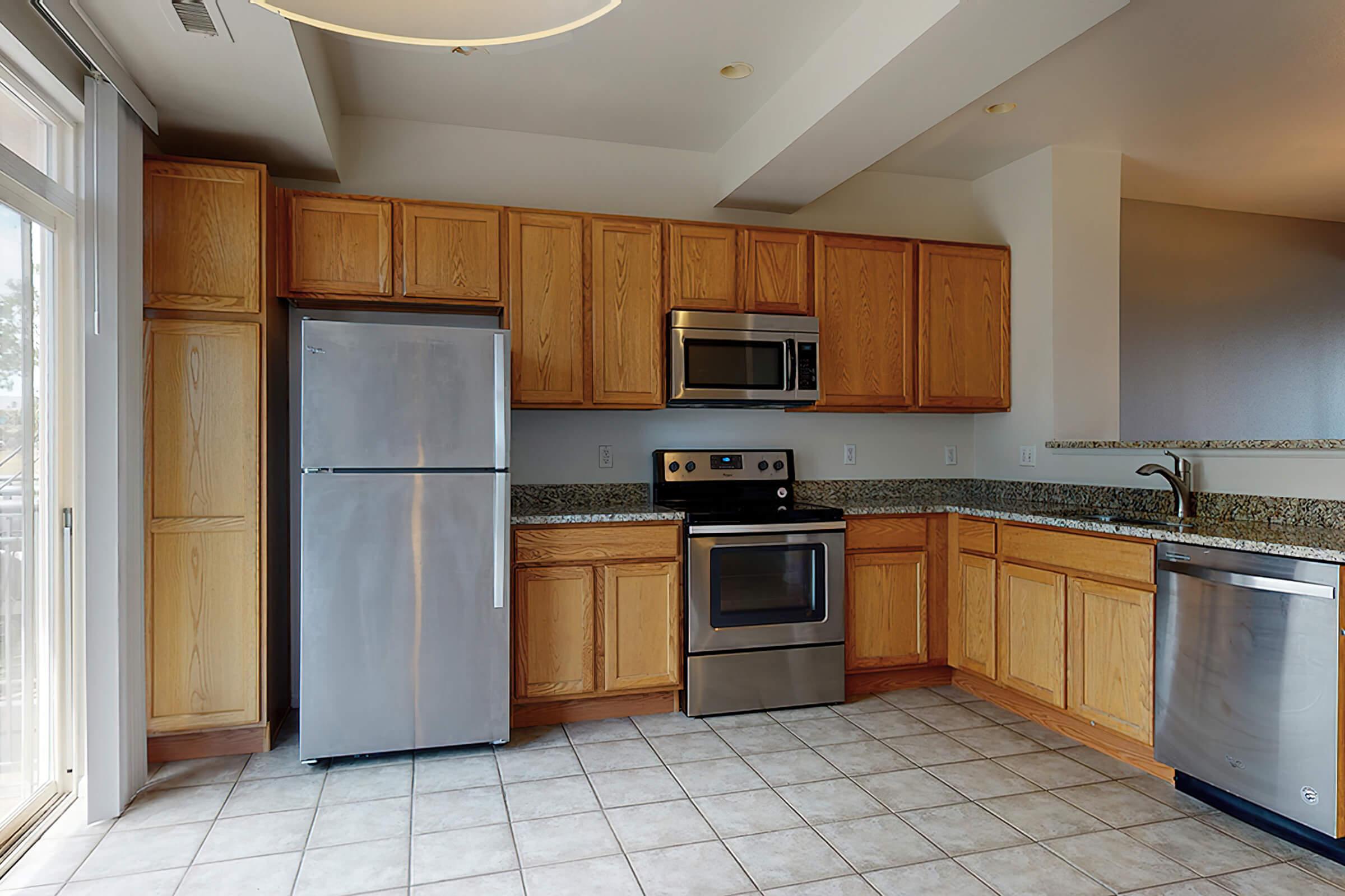 a kitchen with a tile floor