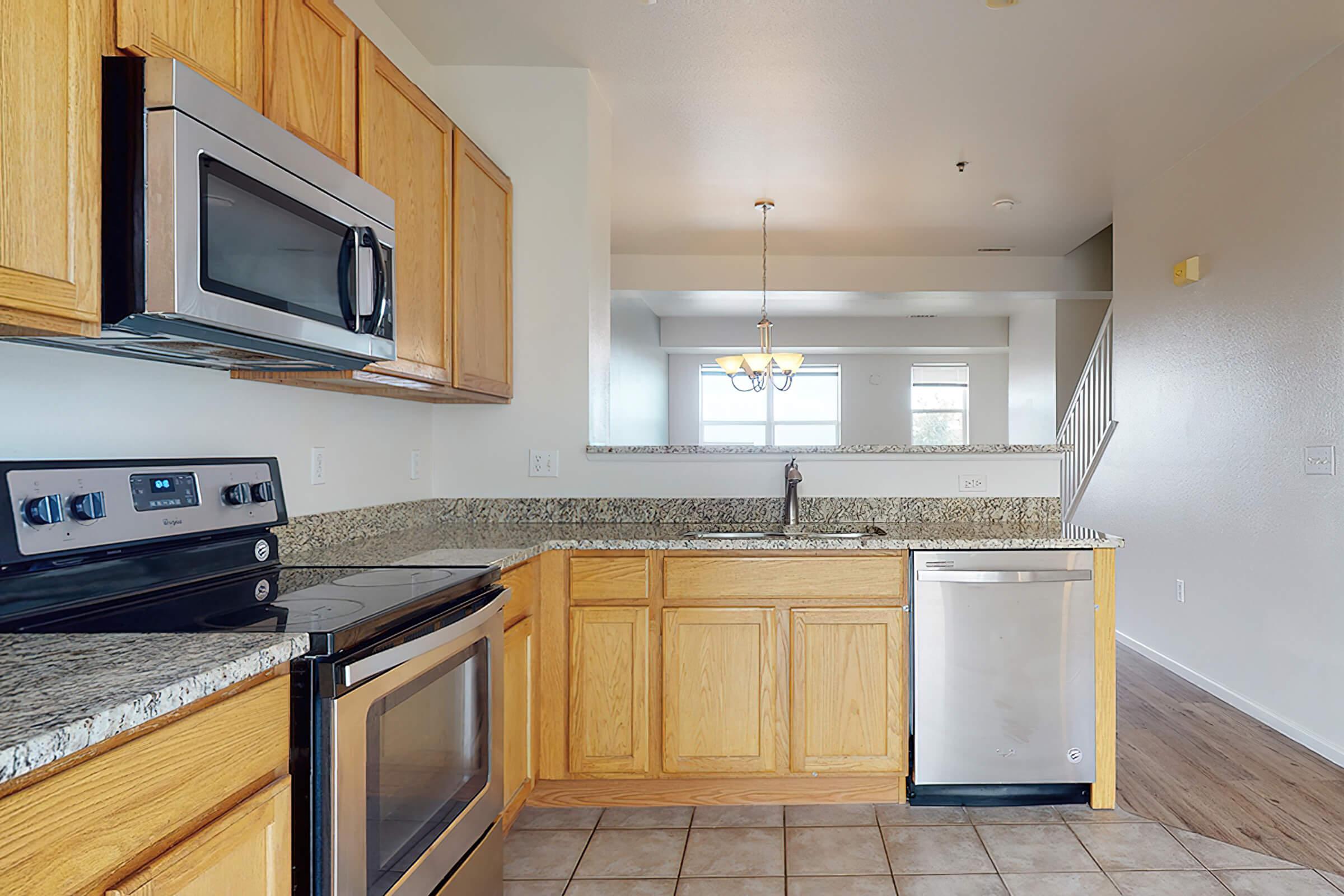 a kitchen with a stove and a microwave