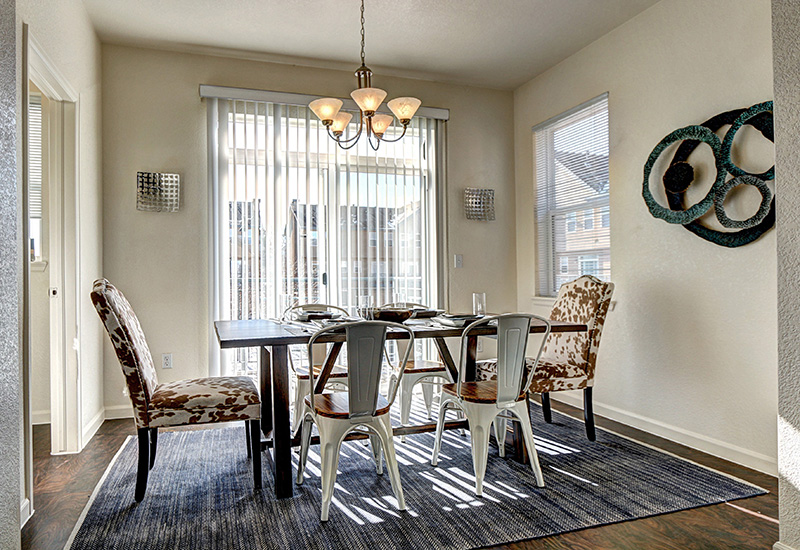 a room filled with furniture and vase on a table