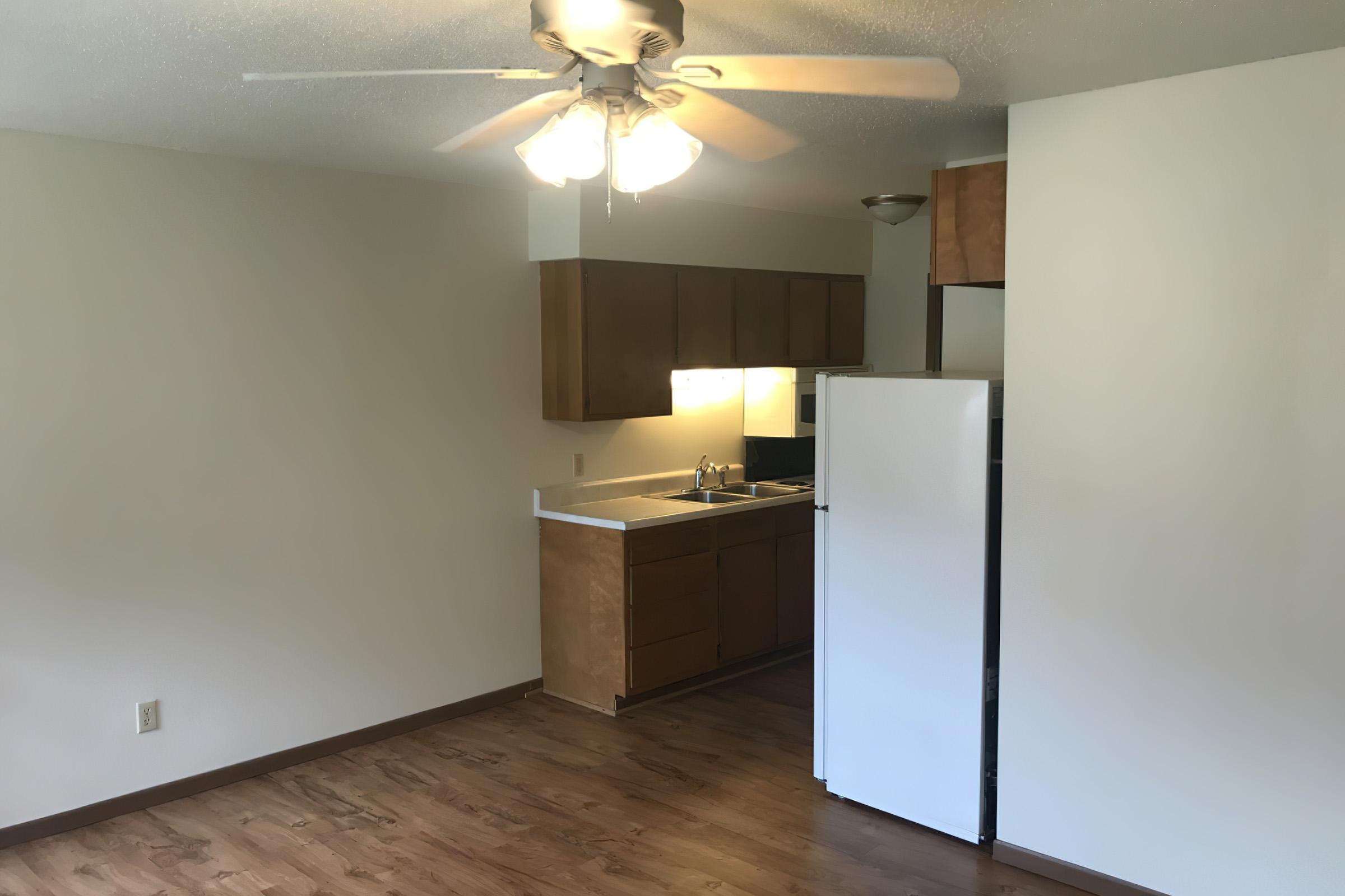 a kitchen with a sink and a refrigerator