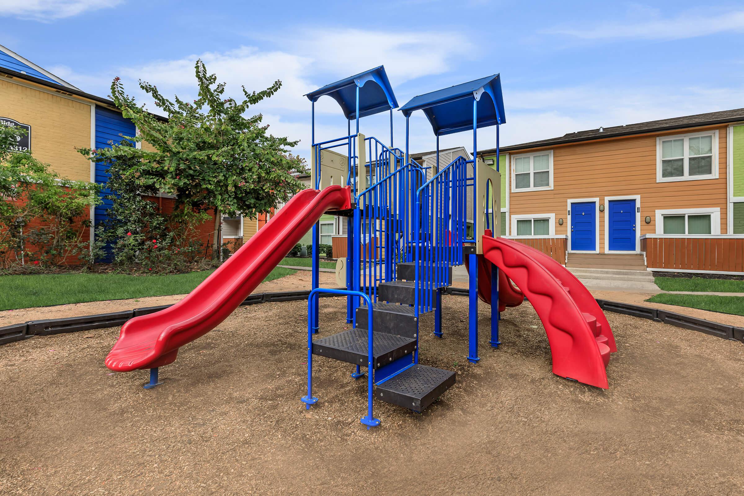 a playground in front of a house
