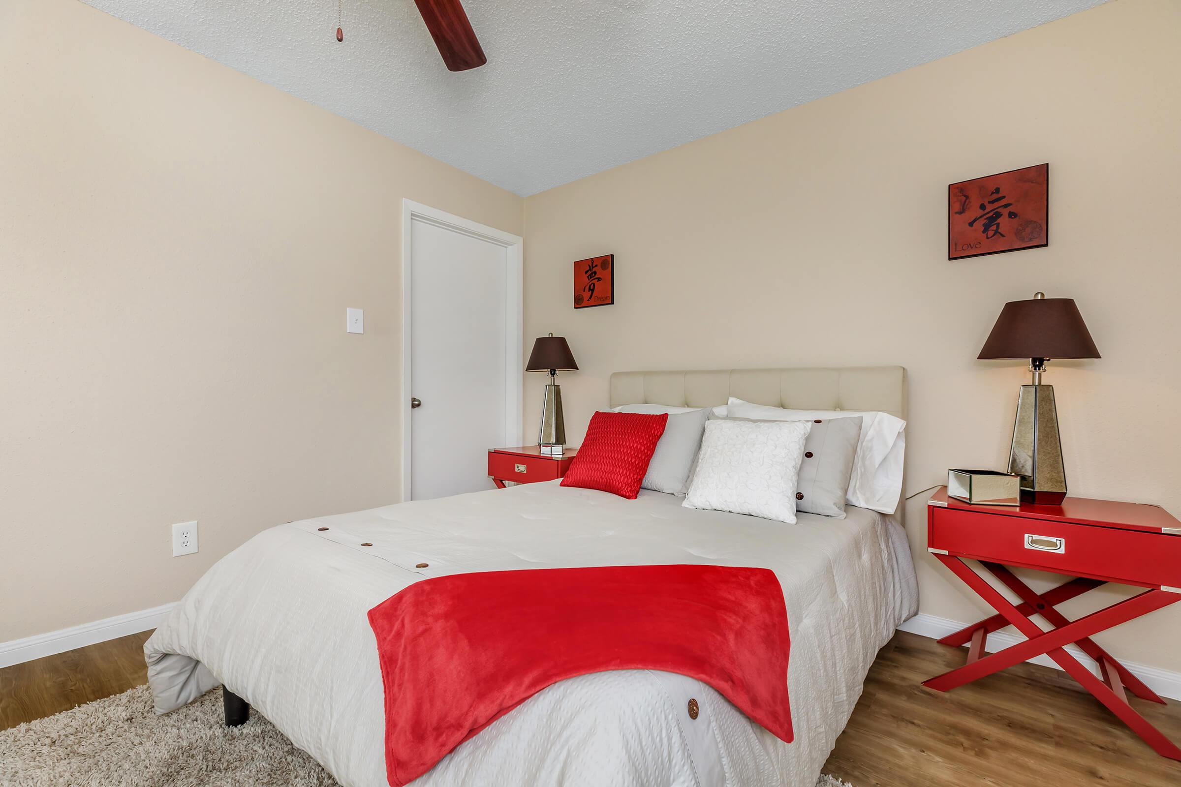 a bedroom with a bed in a room