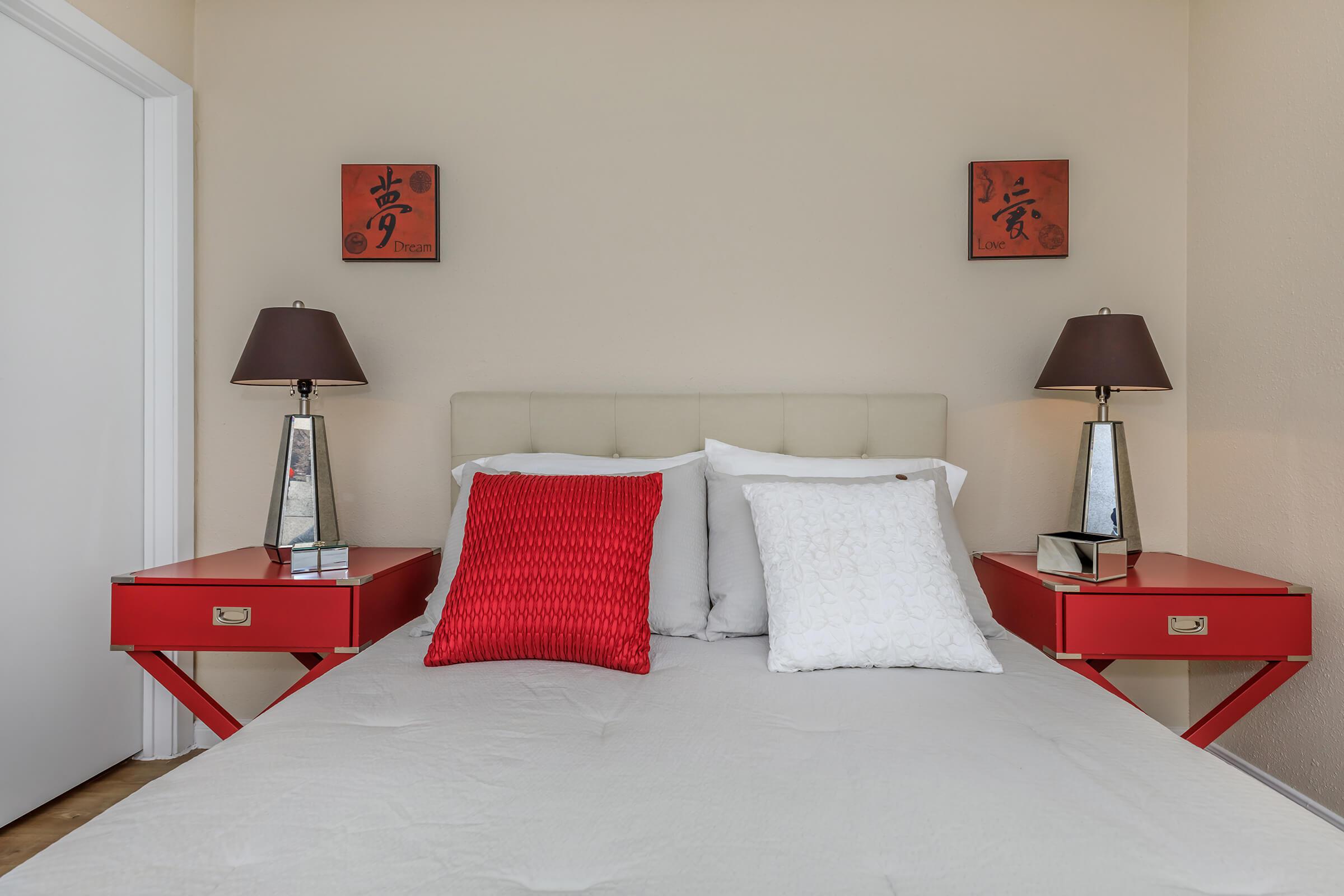a bedroom with a large bed sitting in a room