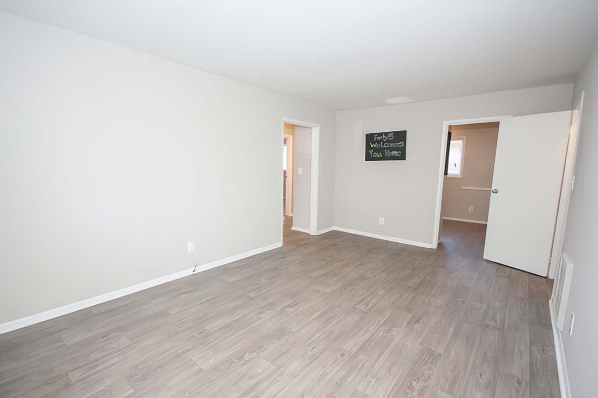 a large empty room with a wooden floor