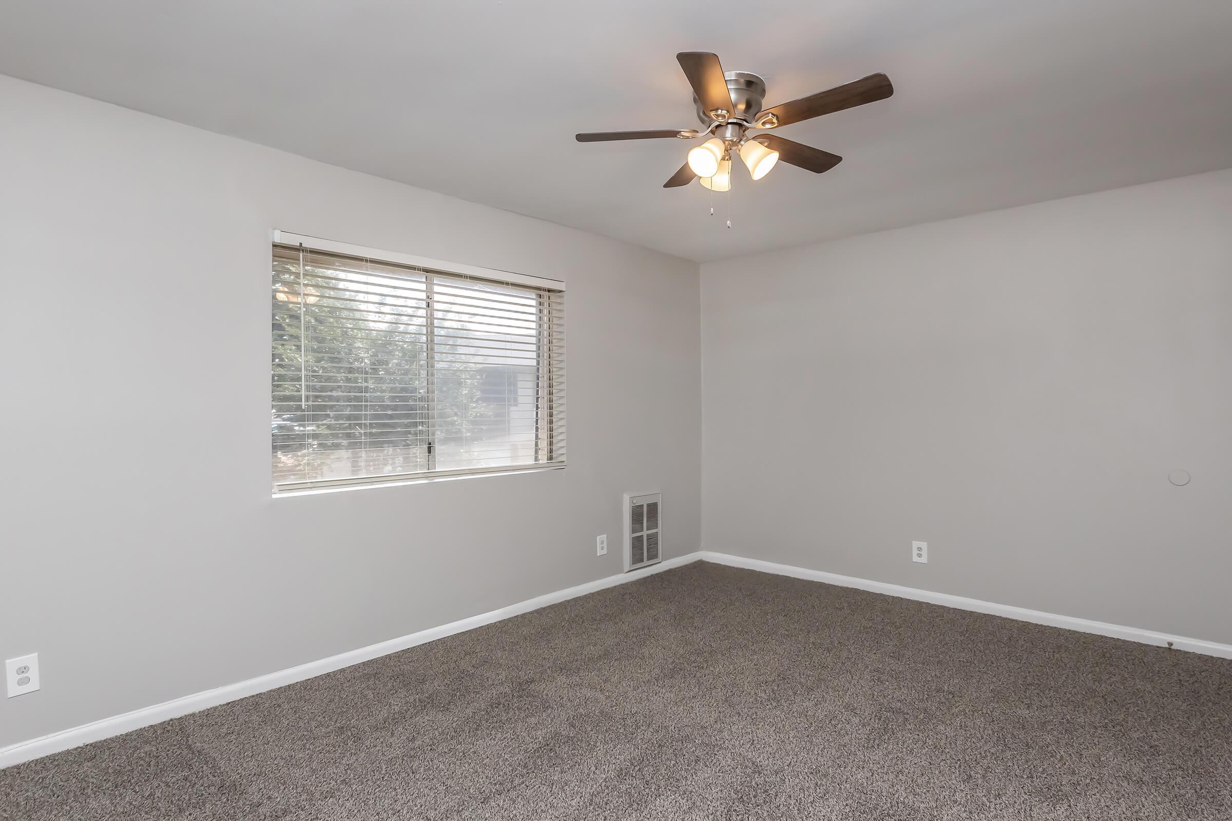 a bedroom with a large window