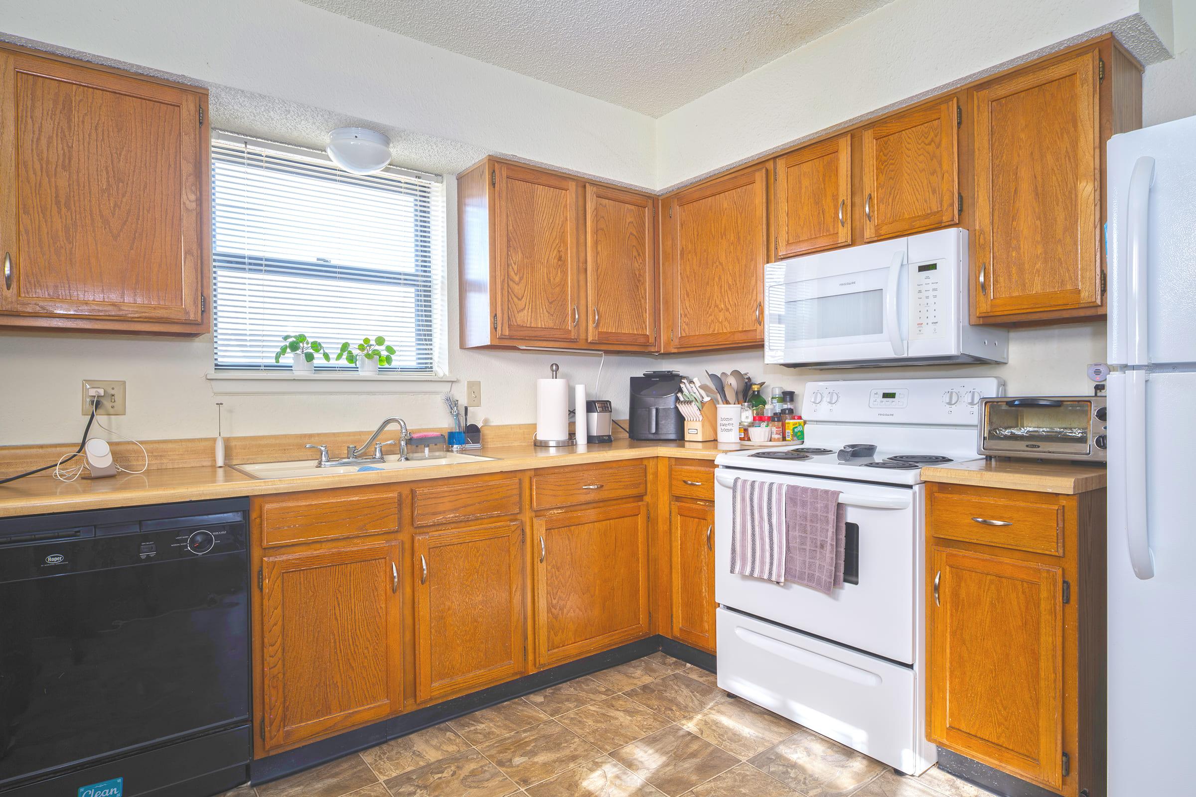 a kitchen with a stove and a refrigerator