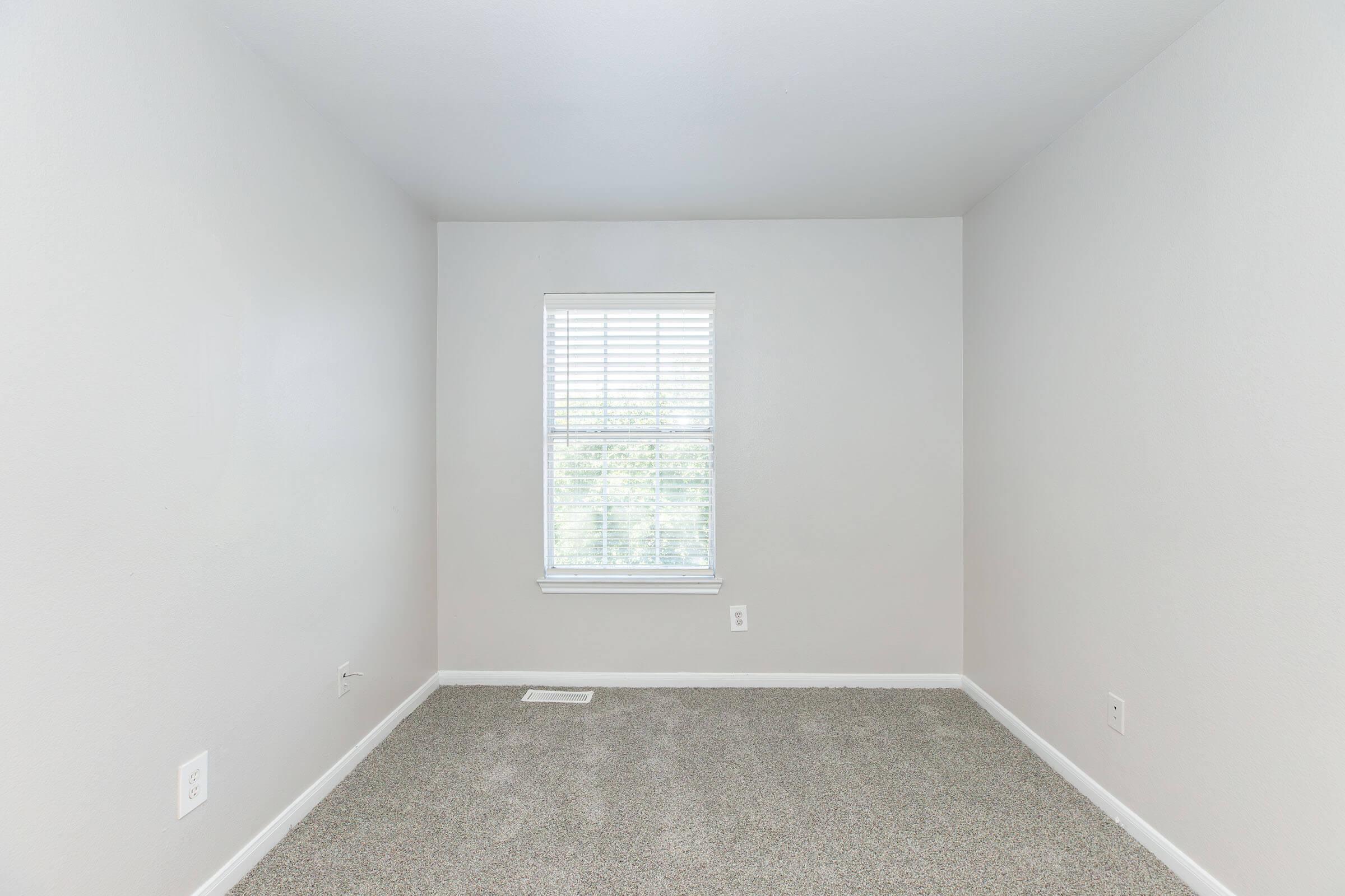 a room with a sink and a window