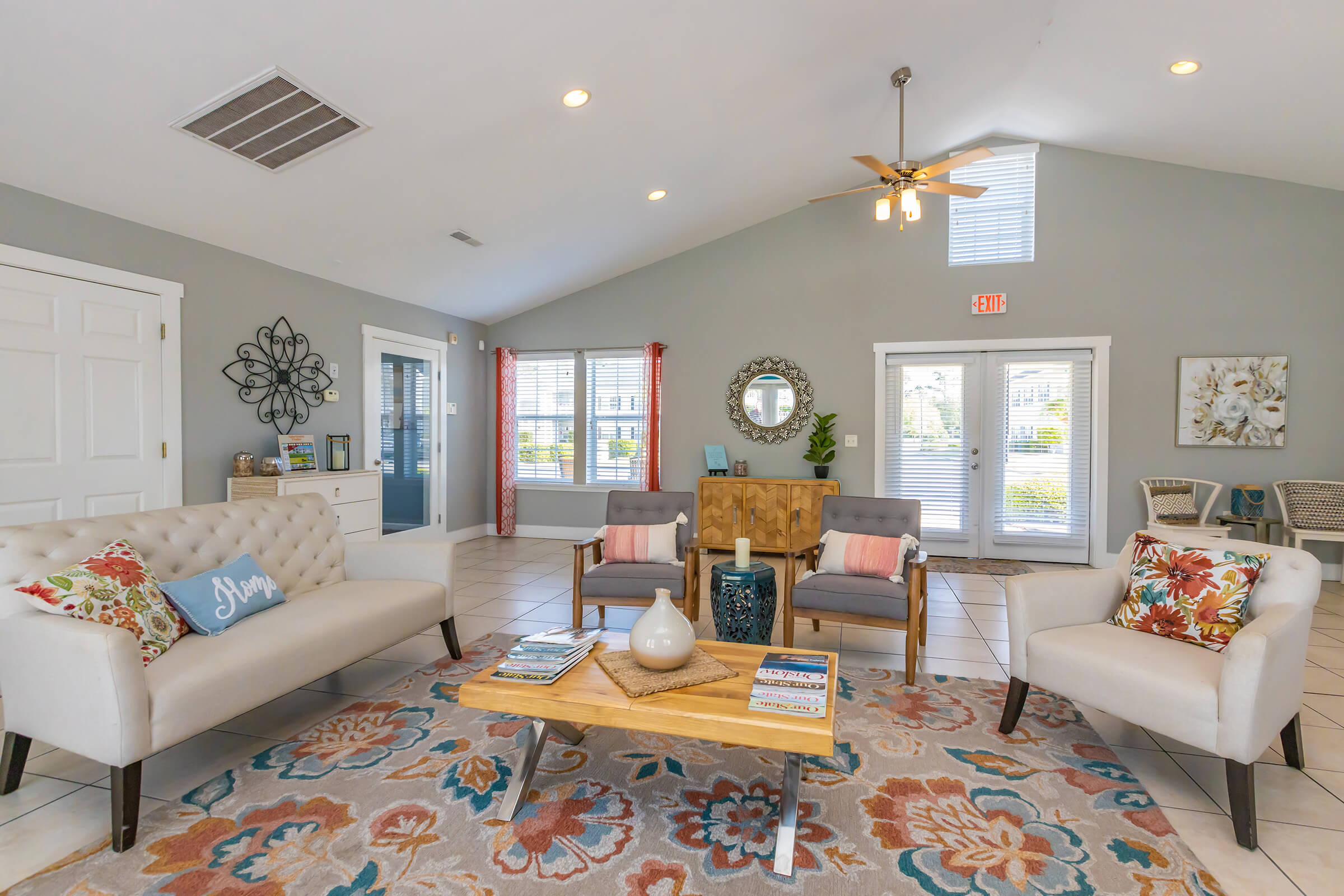 a living room filled with furniture and a fire place