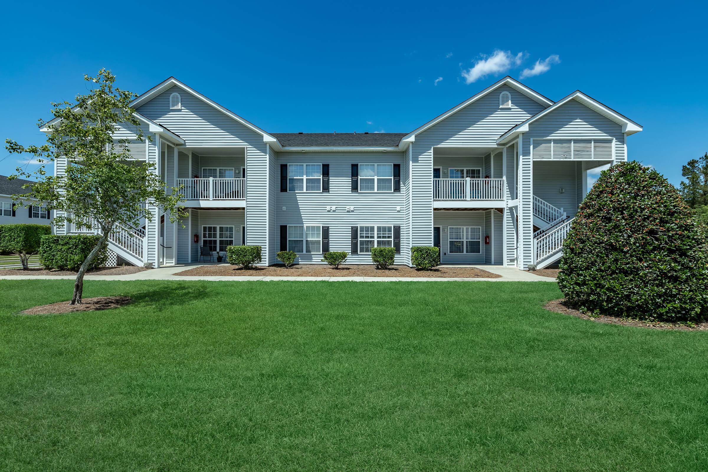 a large lawn in front of a house