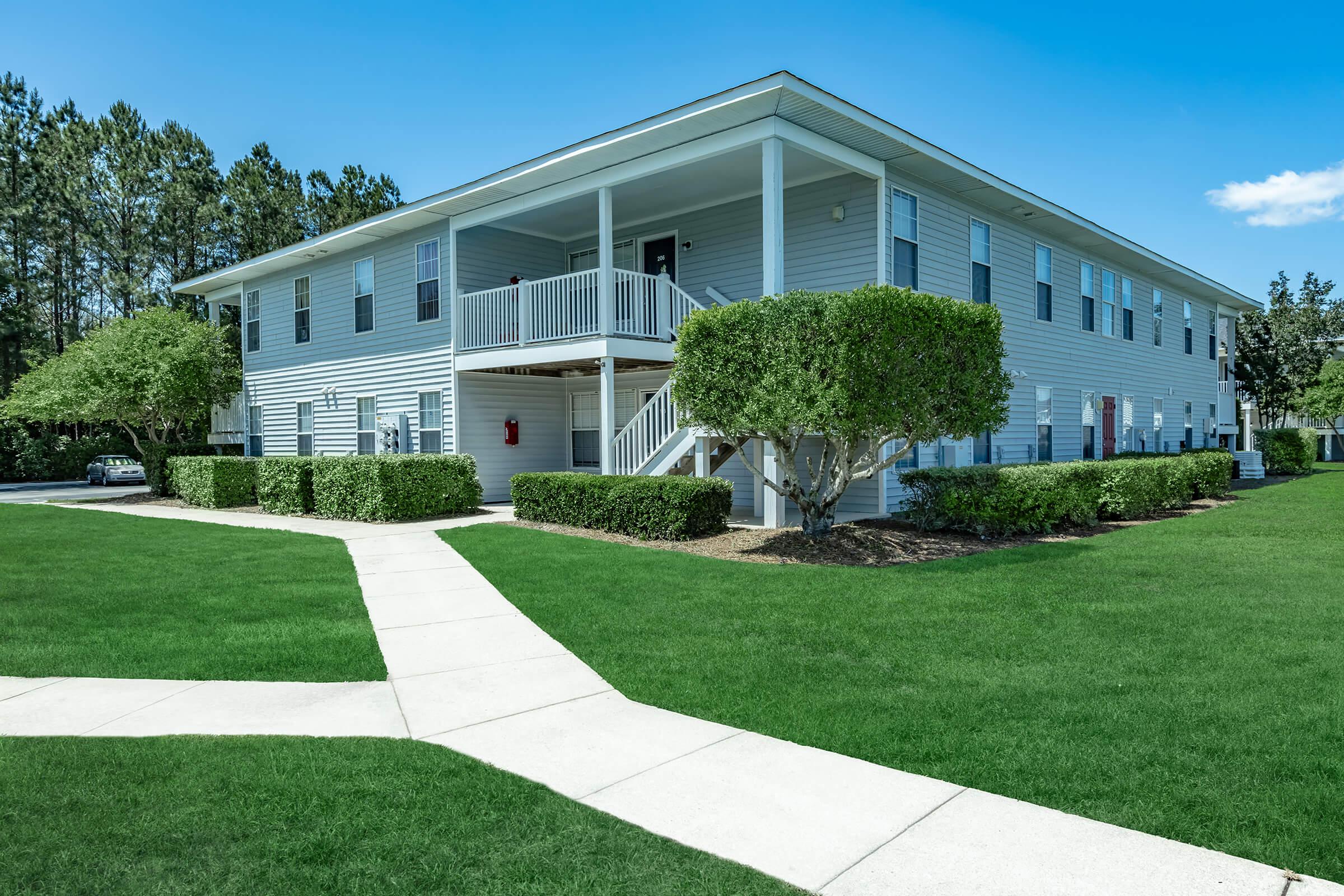 a large lawn in front of a house