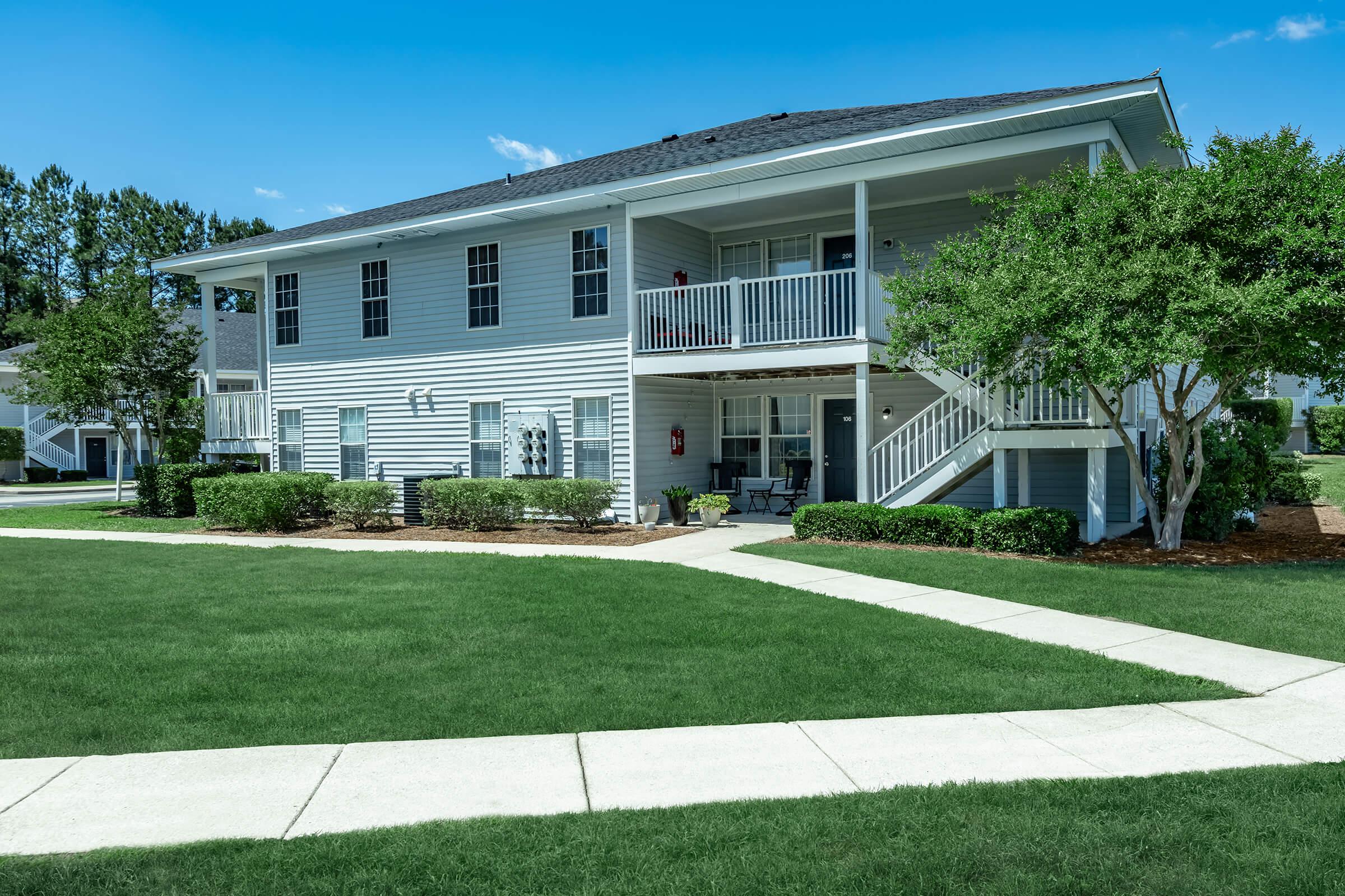 a large lawn in front of a house