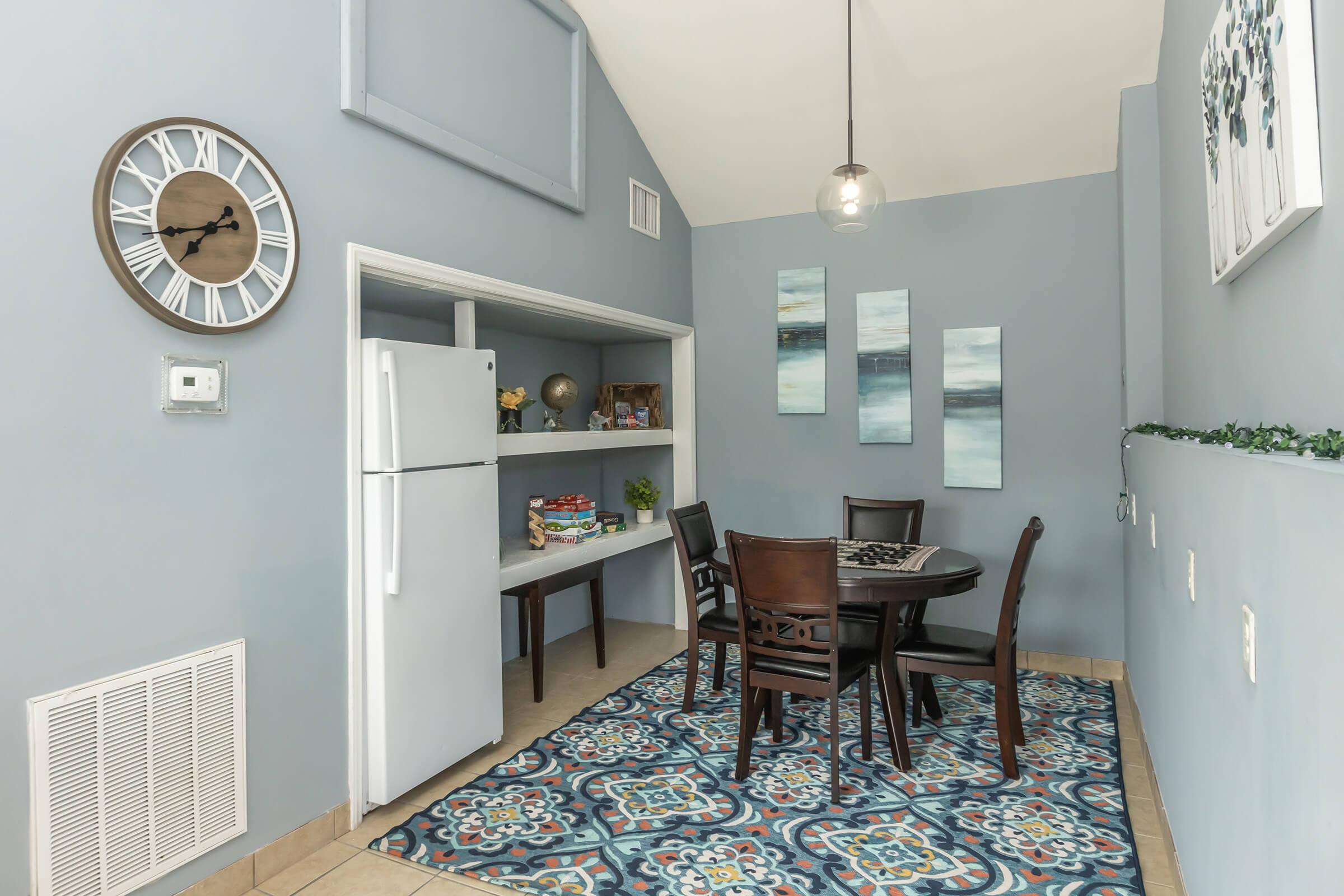 a room that has a clock on a table