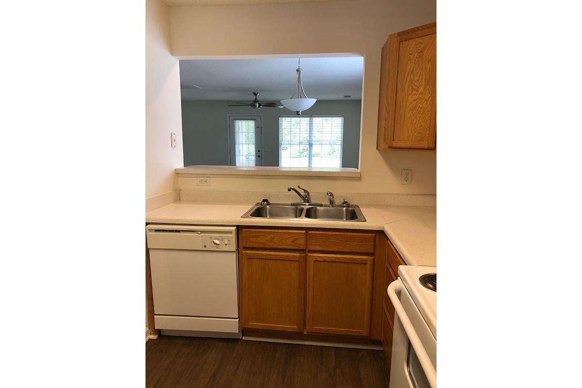 a kitchen with a sink and a refrigerator