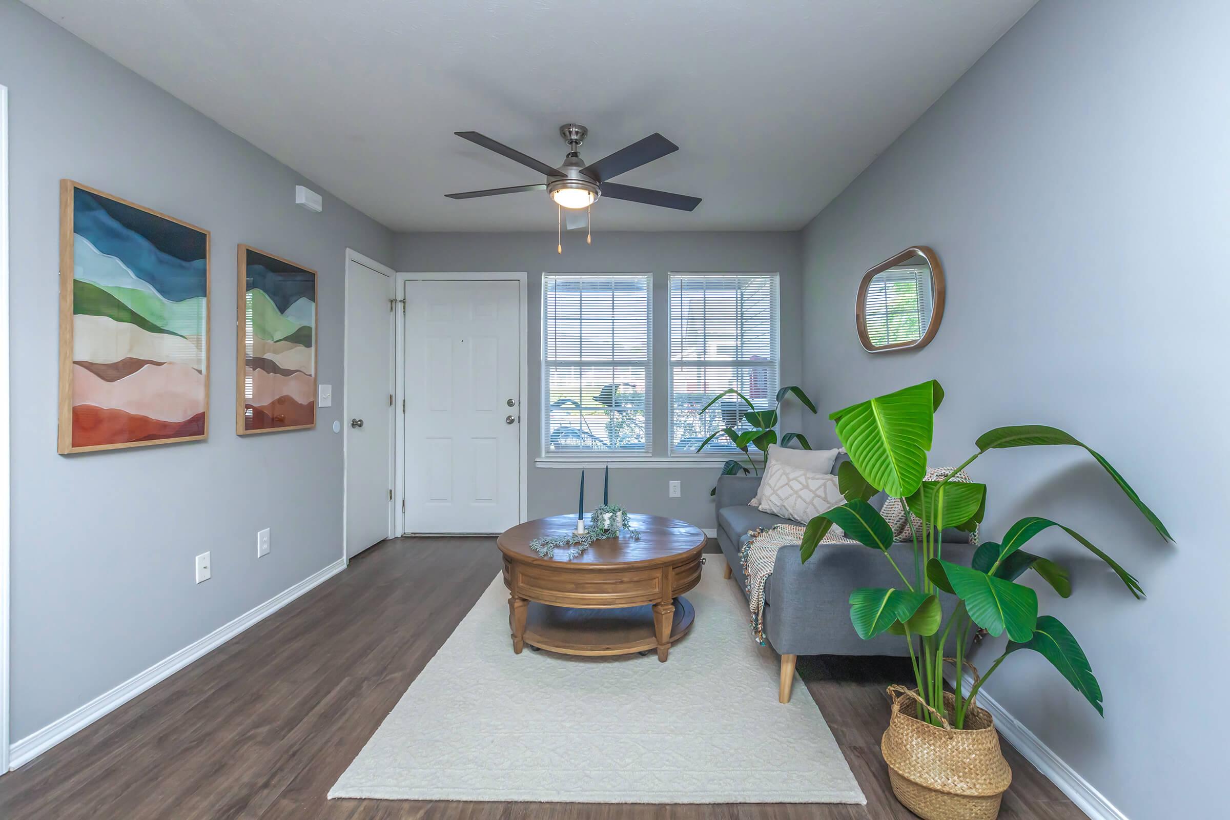 a room filled with furniture and a large window