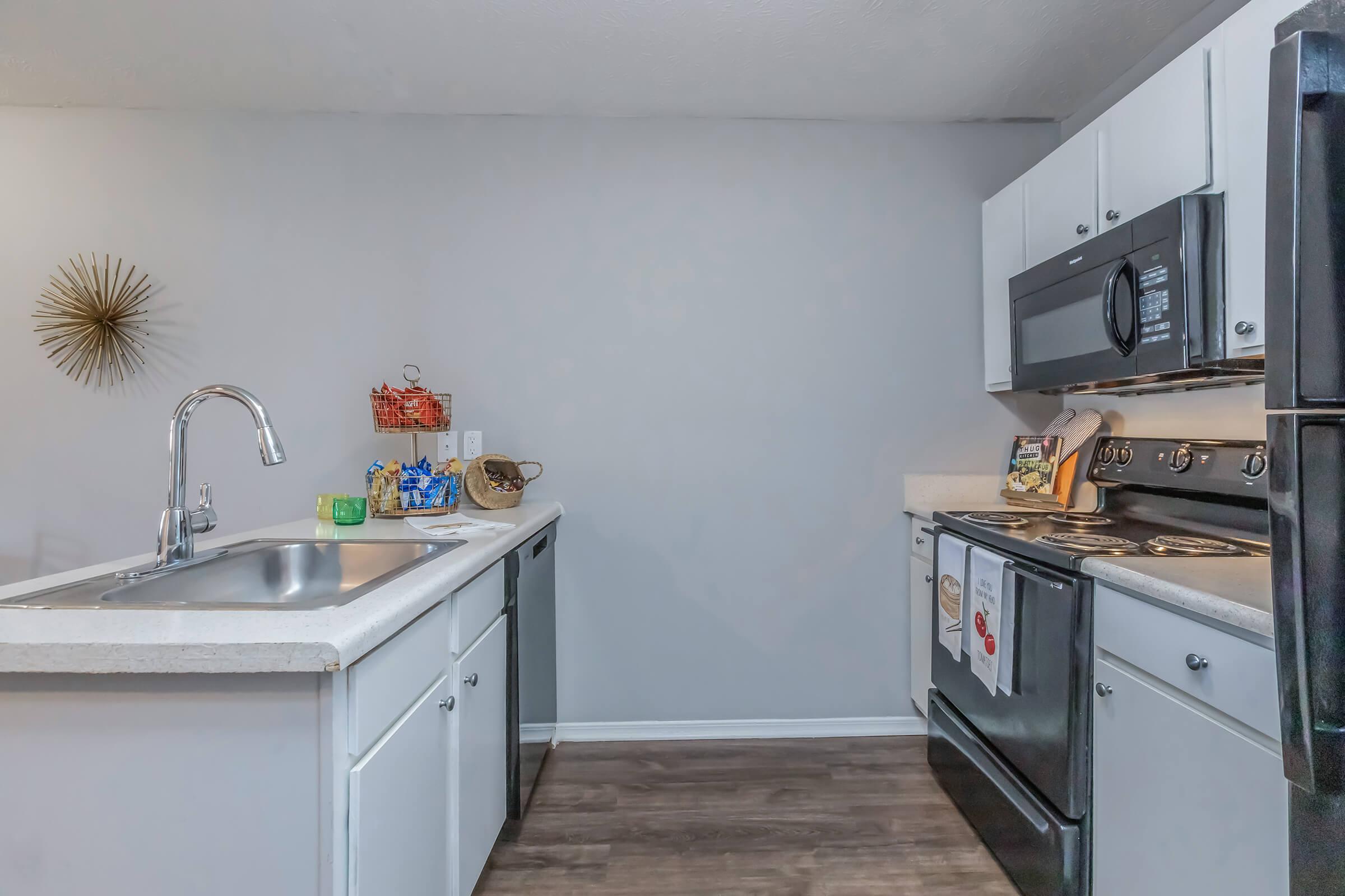 a kitchen with a stove and a sink