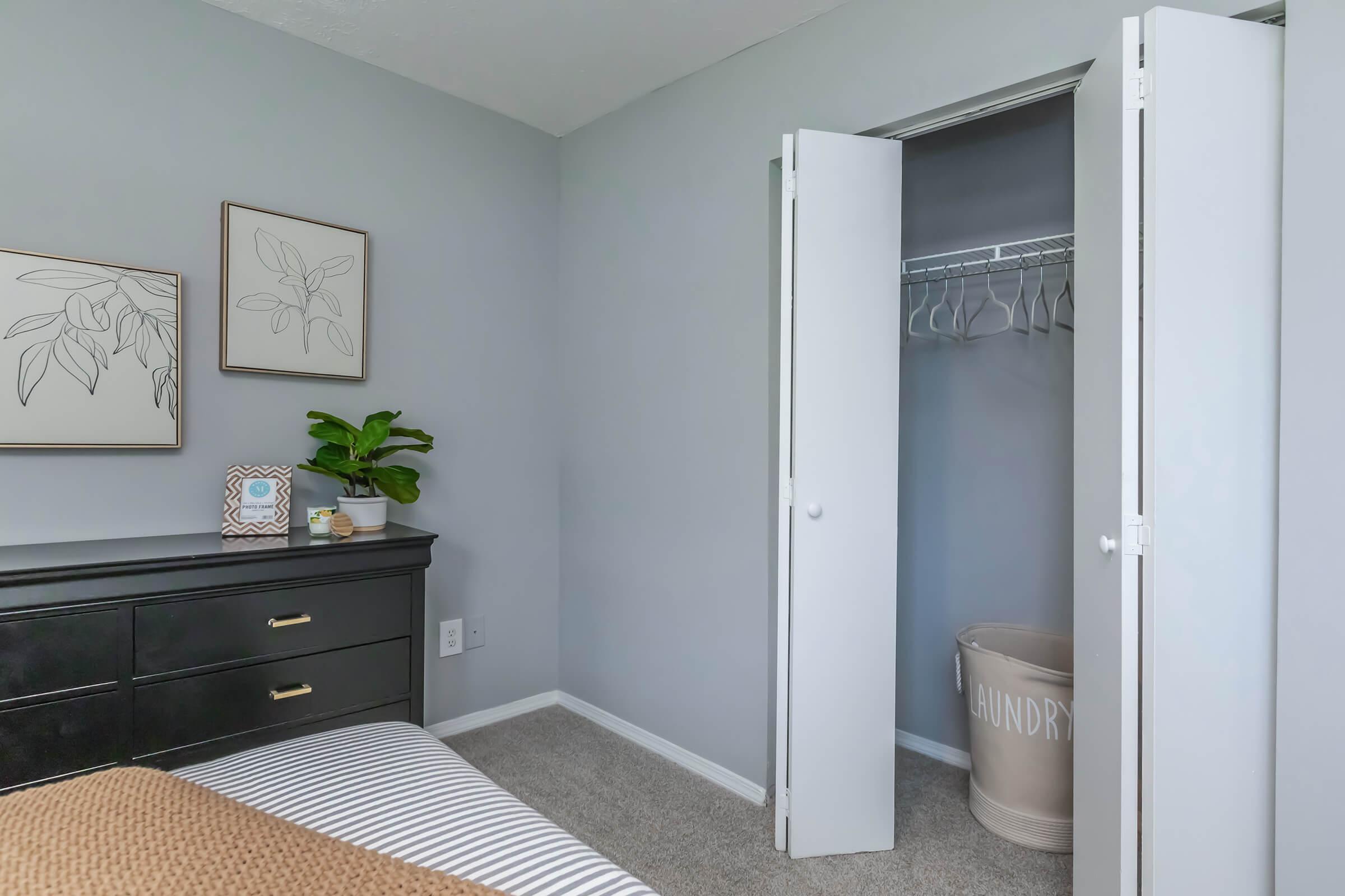 a bedroom with a large mirror