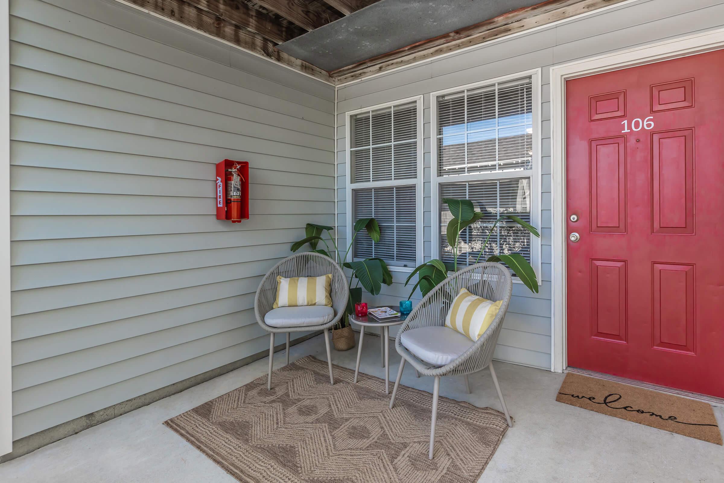 a chair sitting in front of a house