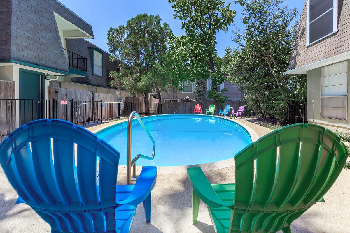 a chair sitting in front of a pool