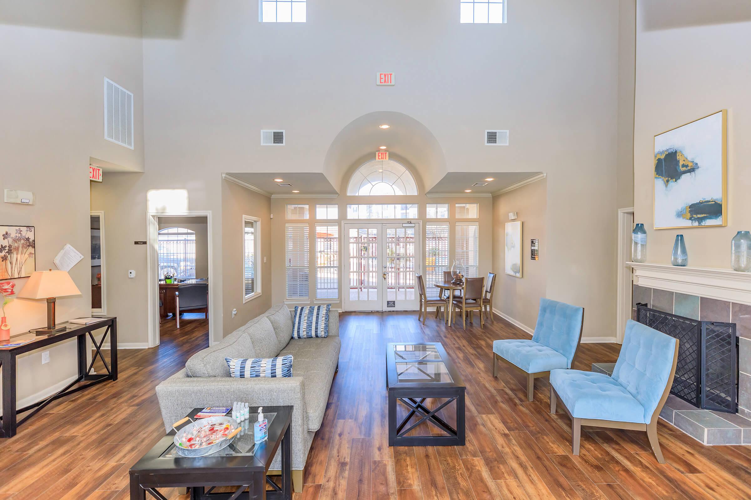 a living room filled with furniture and a fireplace