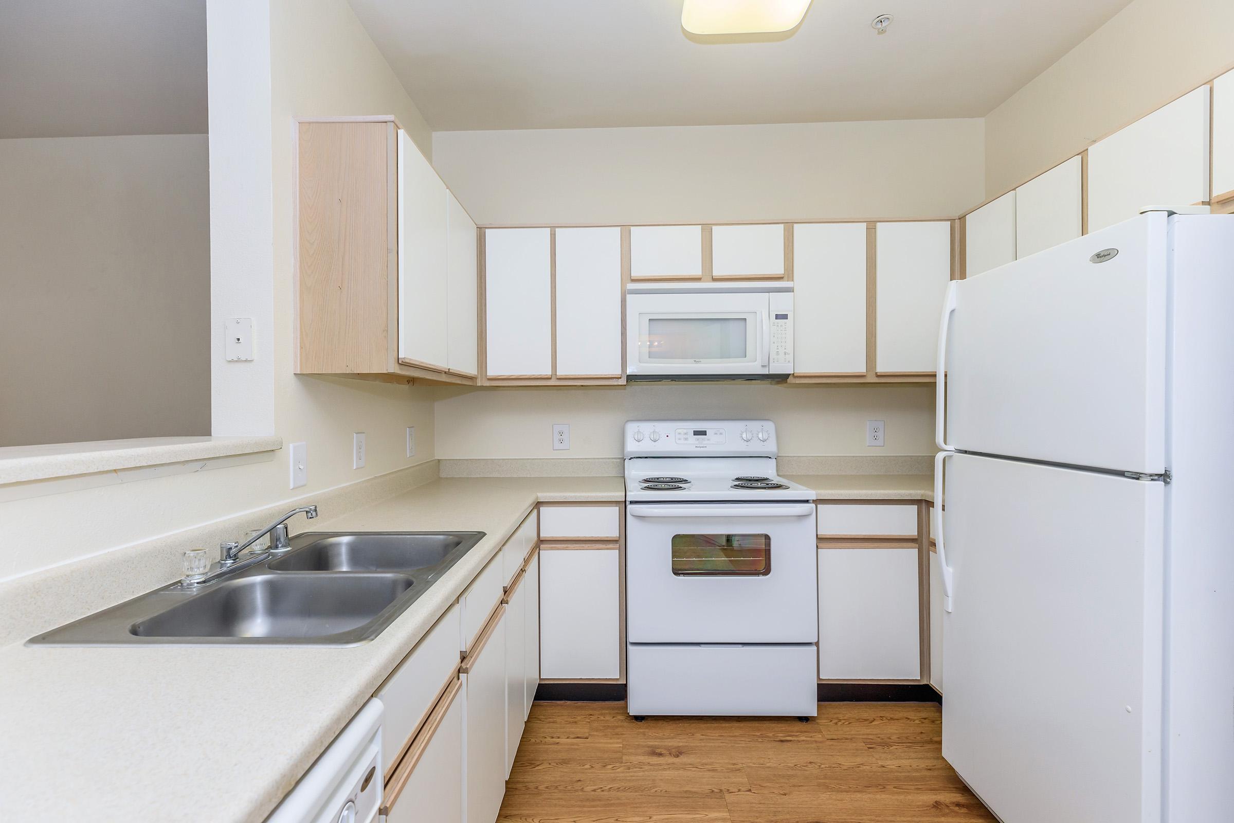 a kitchen with a stove top oven sitting inside of a refrigerator