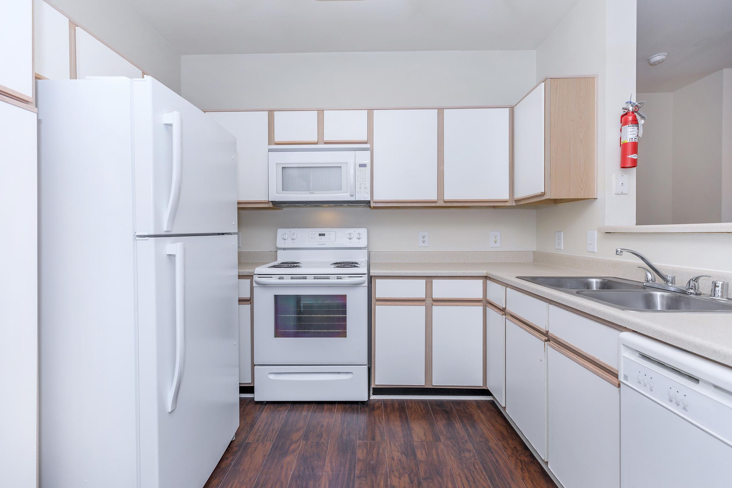 a kitchen with a stove top oven sitting inside of a refrigerator