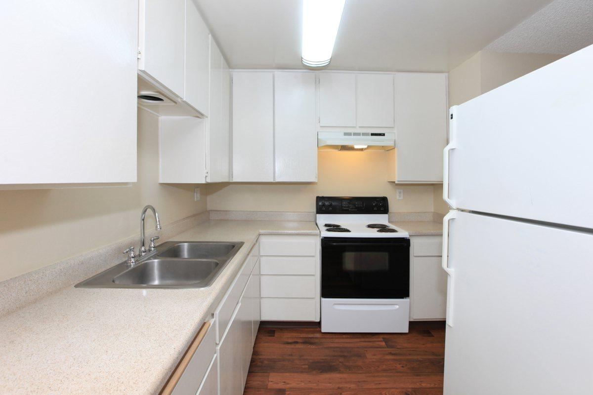 a kitchen with a stove top oven sitting inside of a refrigerator