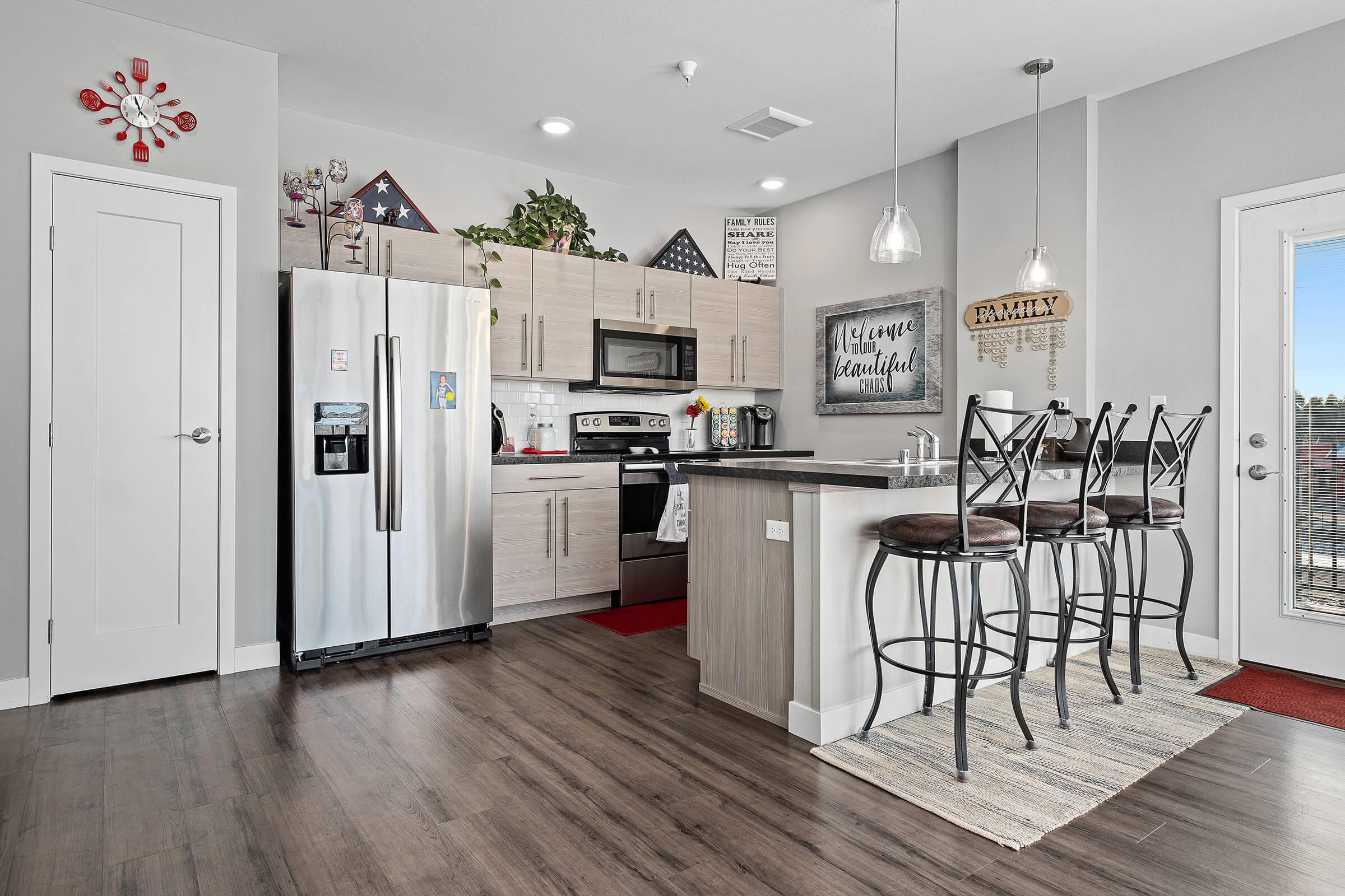 a kitchen with a table in a room