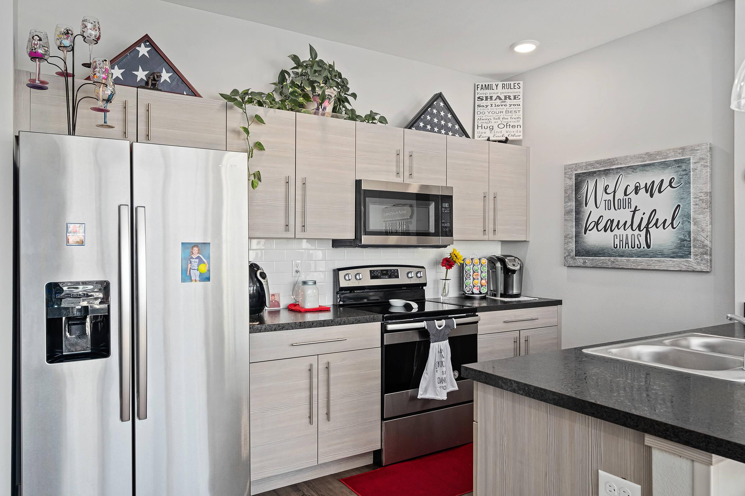 a stainless steel refrigerator in a kitchen