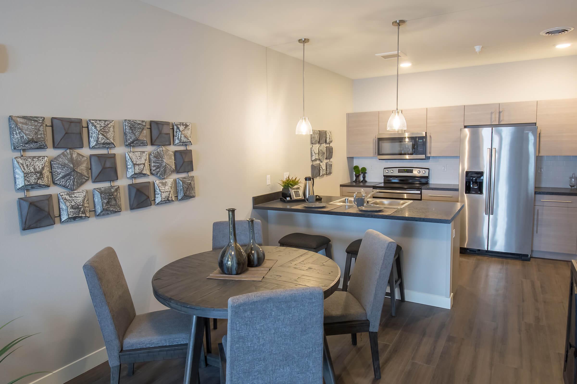 a kitchen with a dining room table