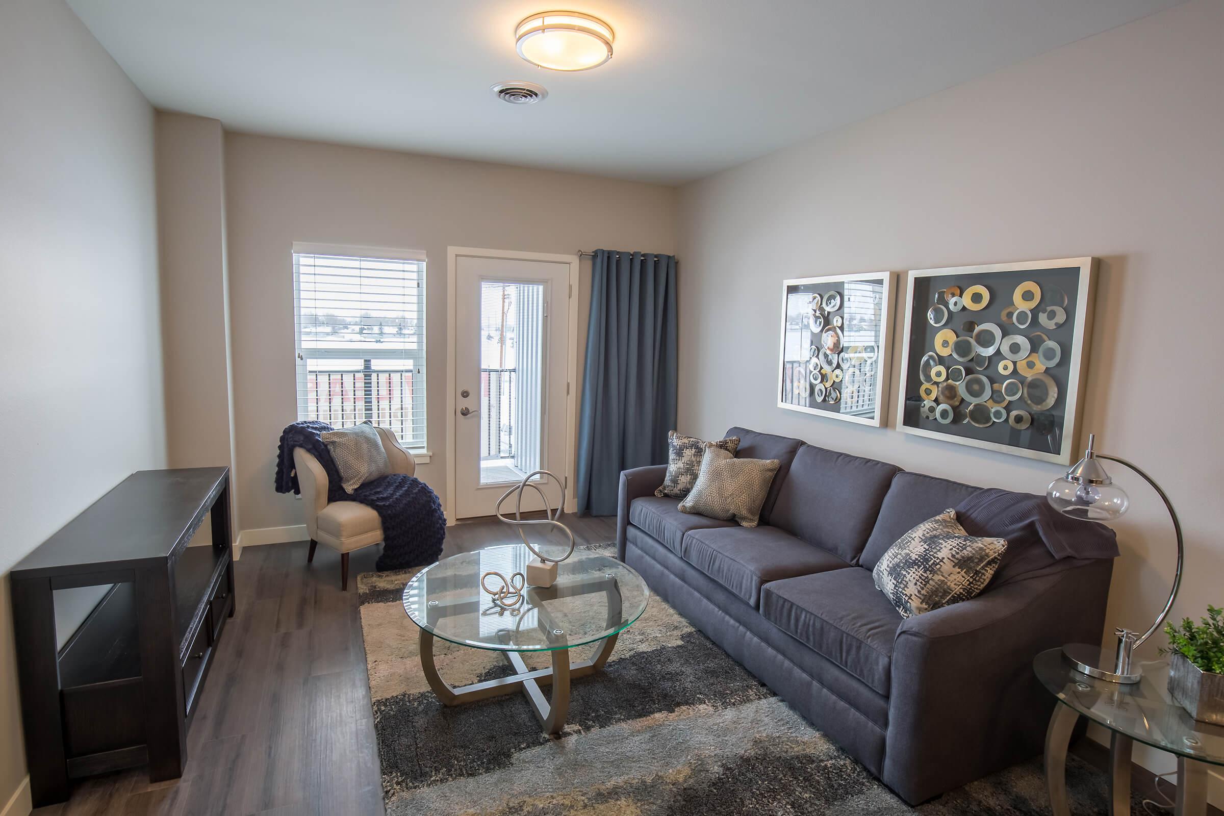 a living room filled with furniture and a fireplace