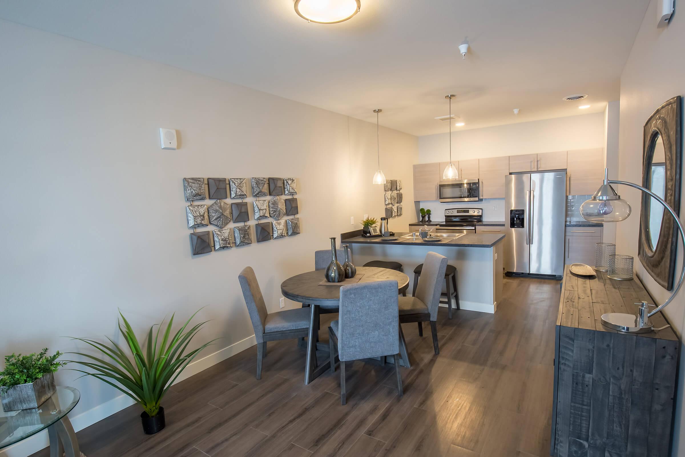 a living room filled with furniture and a table