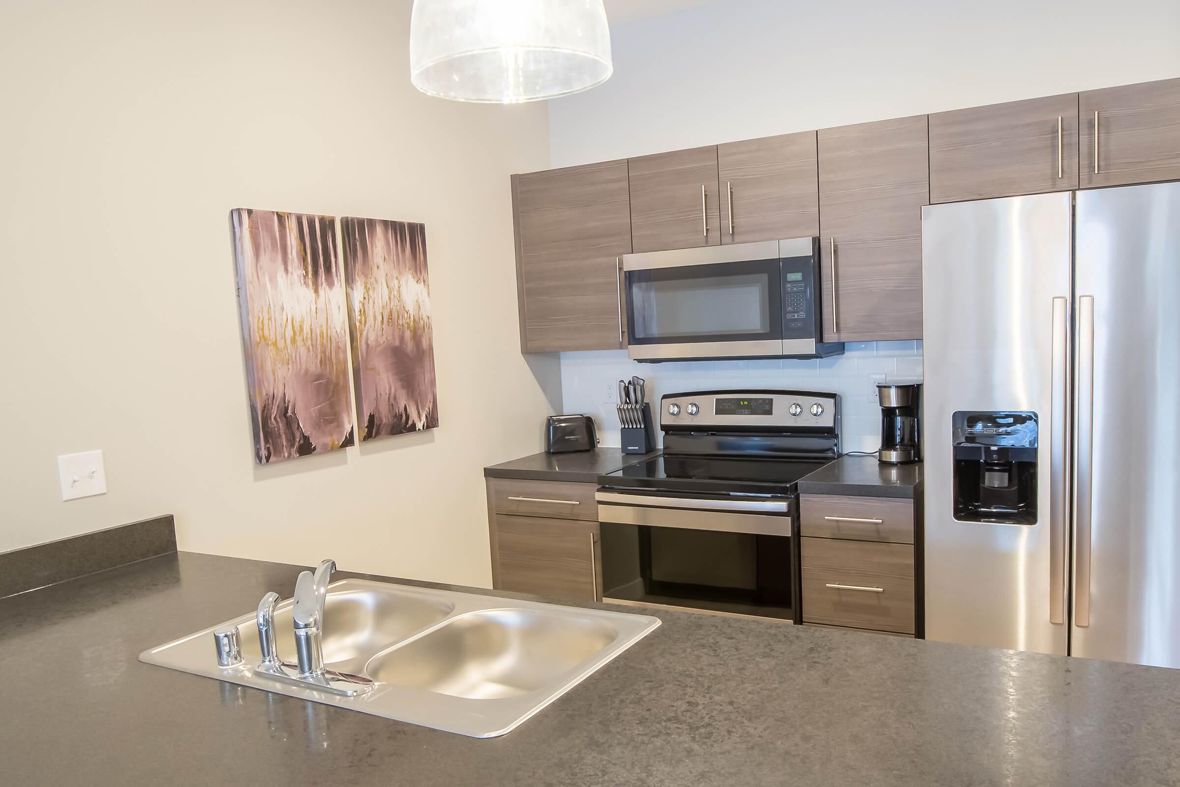 a modern kitchen with stainless steel appliances