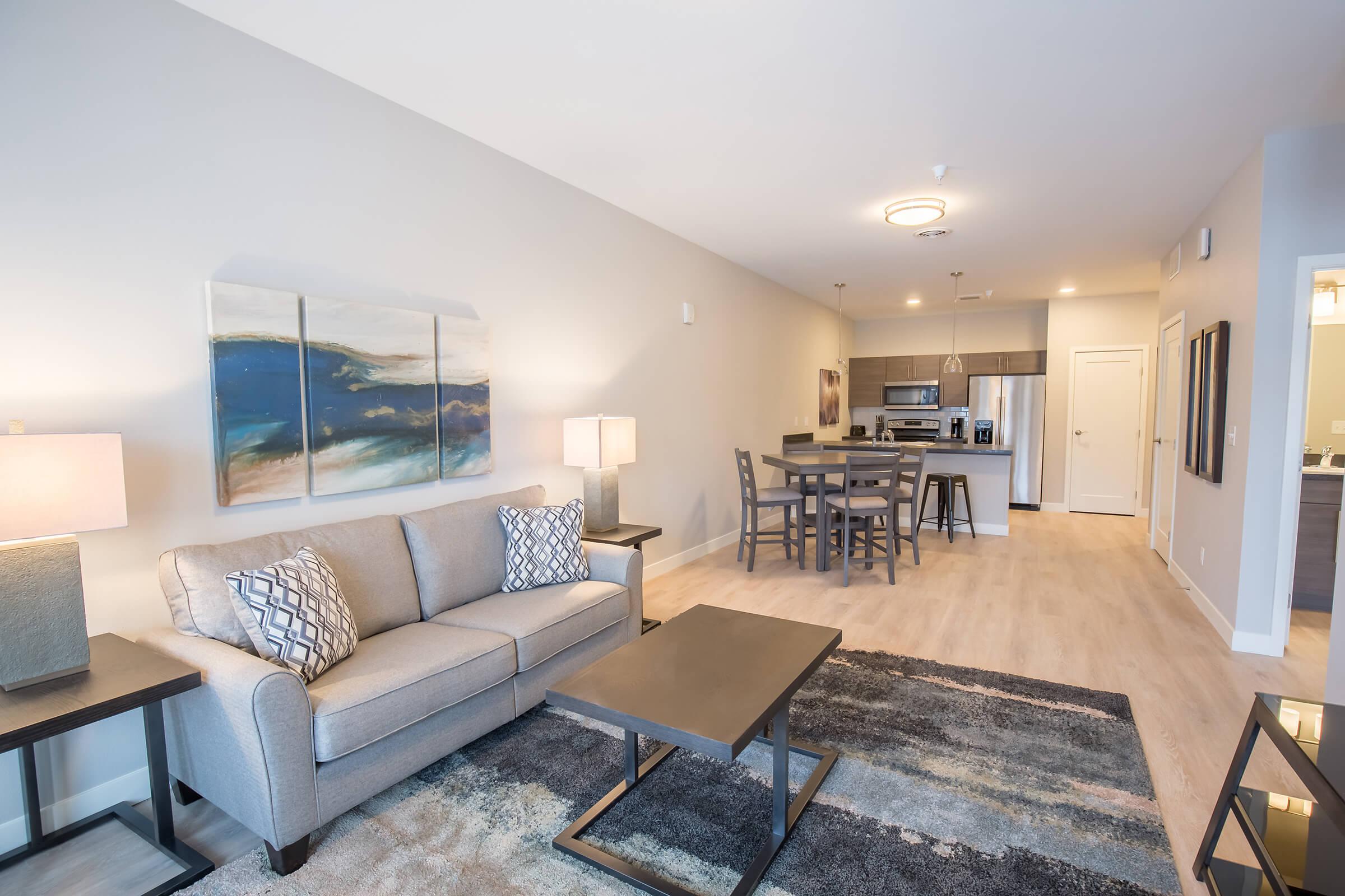 a living room filled with furniture and a table