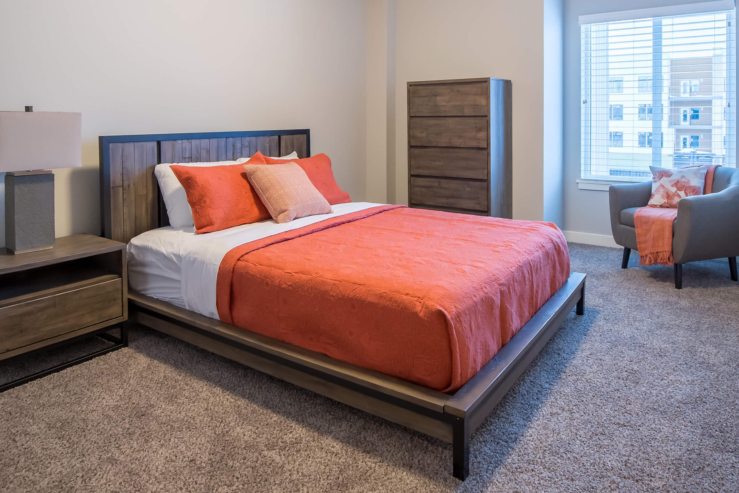 a bedroom with a large bed in a hotel room